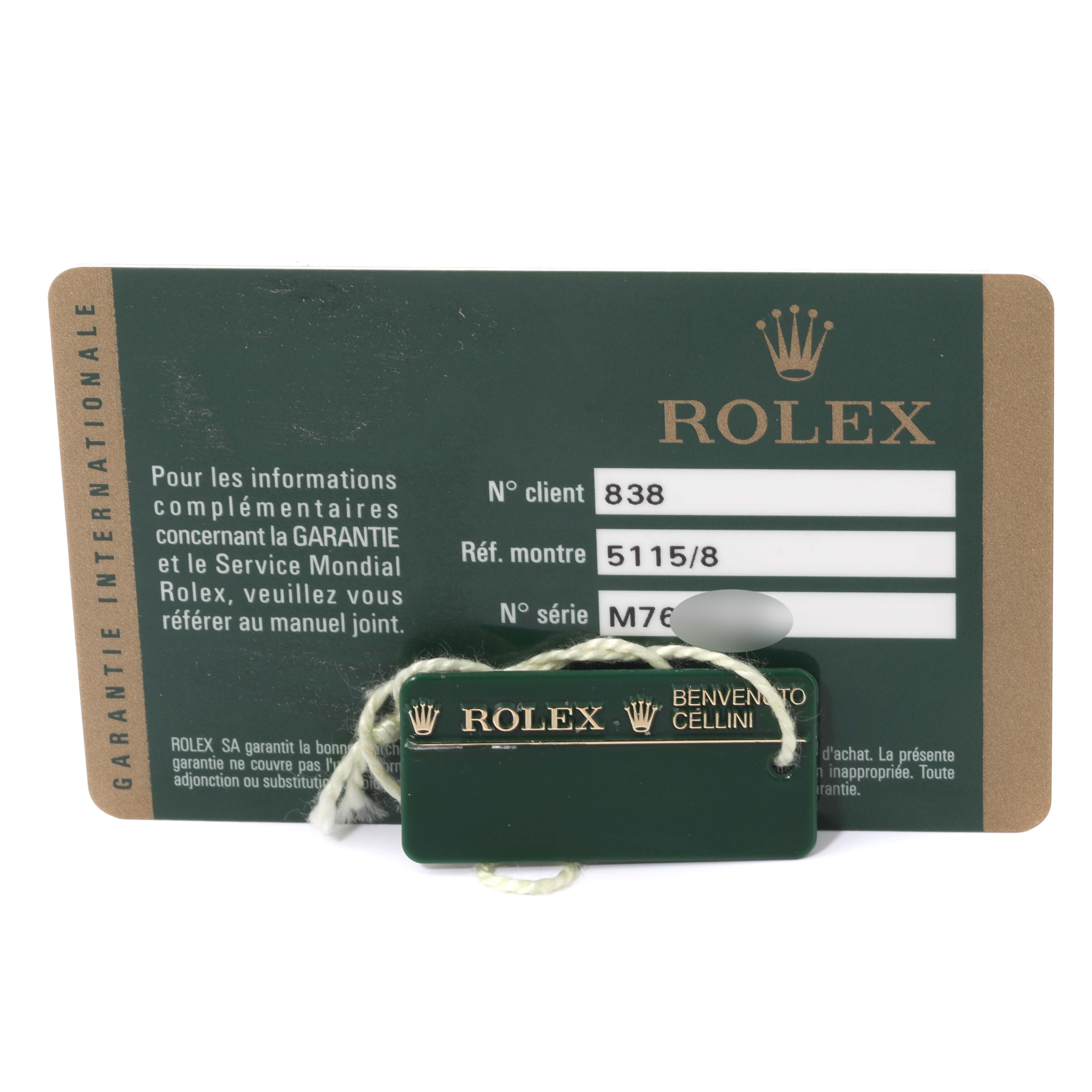The image shows a warranty card and a green tag for the Rolex Cellini 5115/8 Men's Yellow Gold White Dial 5115/8 Men's Yellow Gold White Dial model, with reference and serial numbers visible.