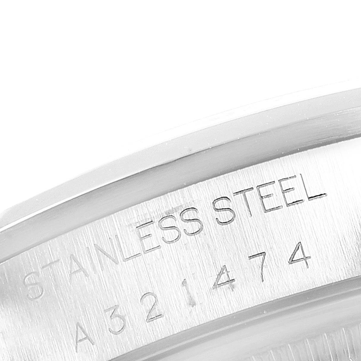 The image shows a close-up of the engraved serial number and "STAINLESS STEEL" text on the side of the Rolex Date 15200 Men's Stainless Steel Black Dial 15200 Men's Stainless Steel Black Dial watch.