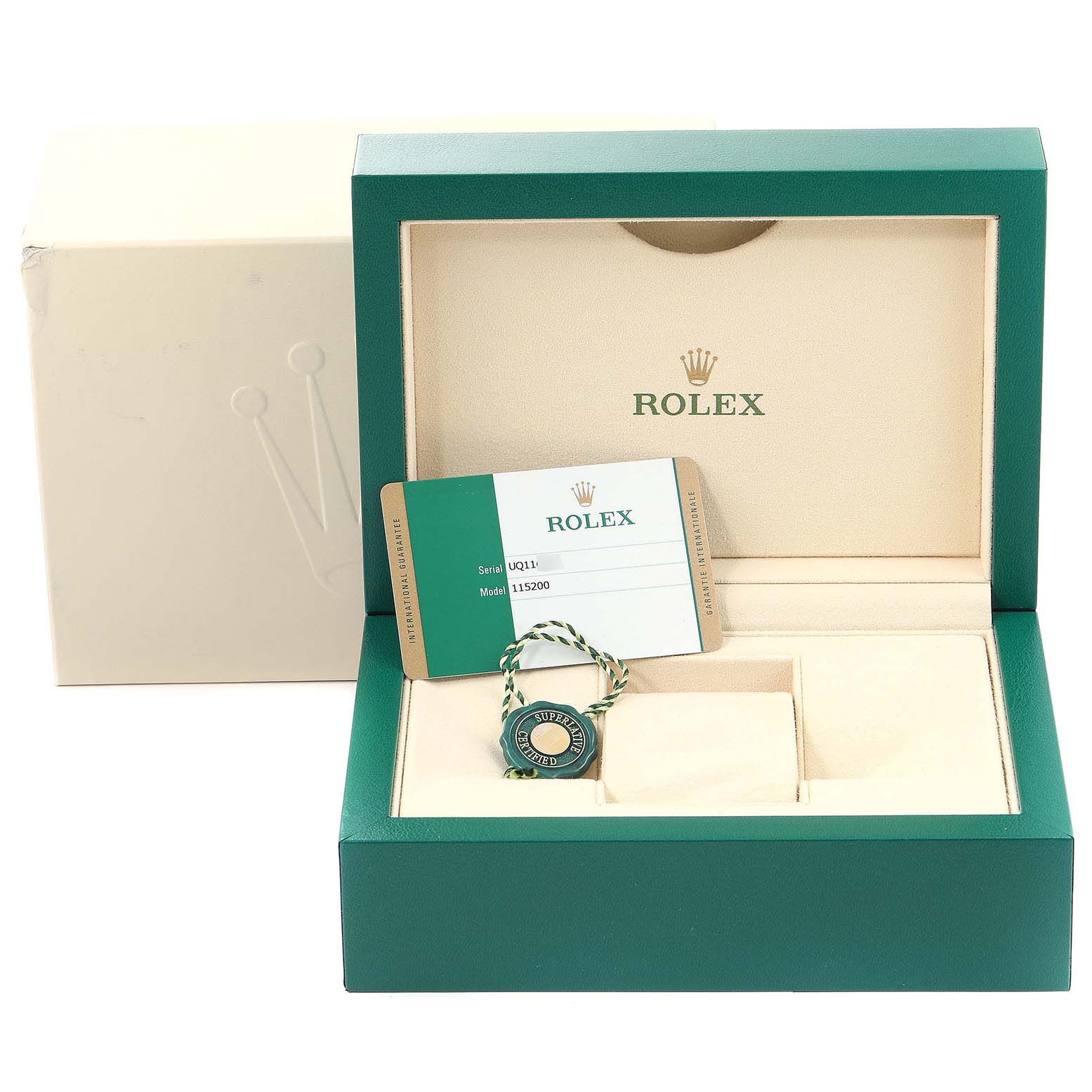 The image shows the open box and accessories, including a card and tag, for the Rolex Date 115200 Men's Stainless Steel Blue Dial 115200 Men's Stainless Steel Blue Dial model watch.
