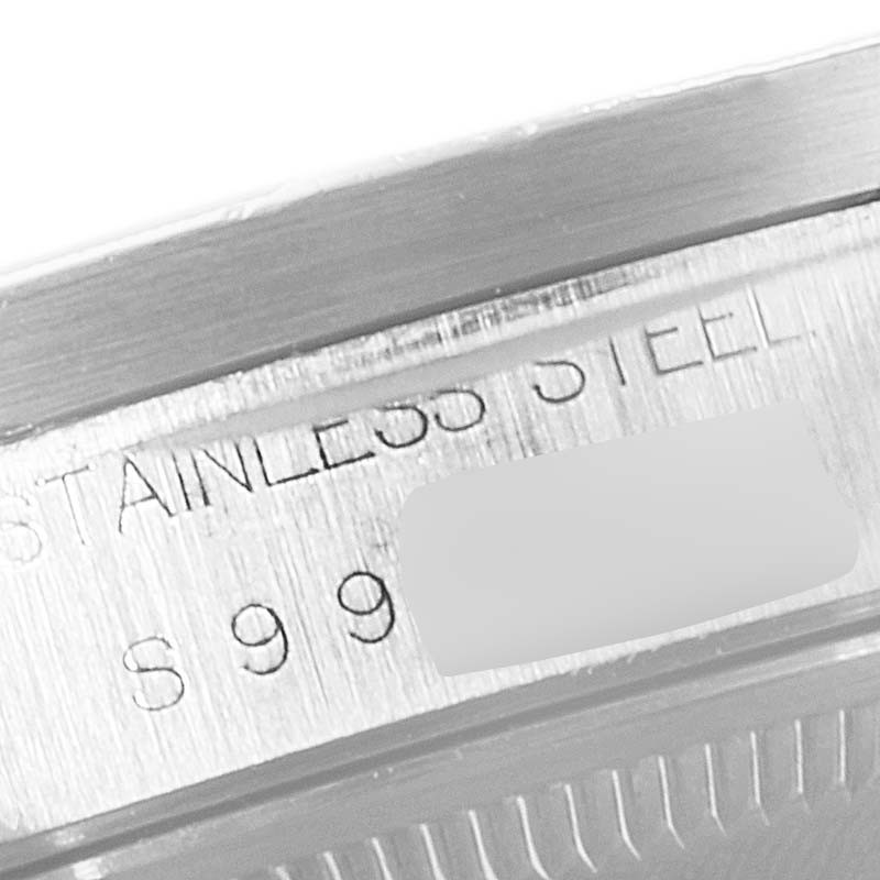 This close-up image shows the edge of the stainless steel case with engraving for a Rolex Date 15210 Men's Stainless Steel White Dial 15210 Men's Stainless Steel White Dial model watch.