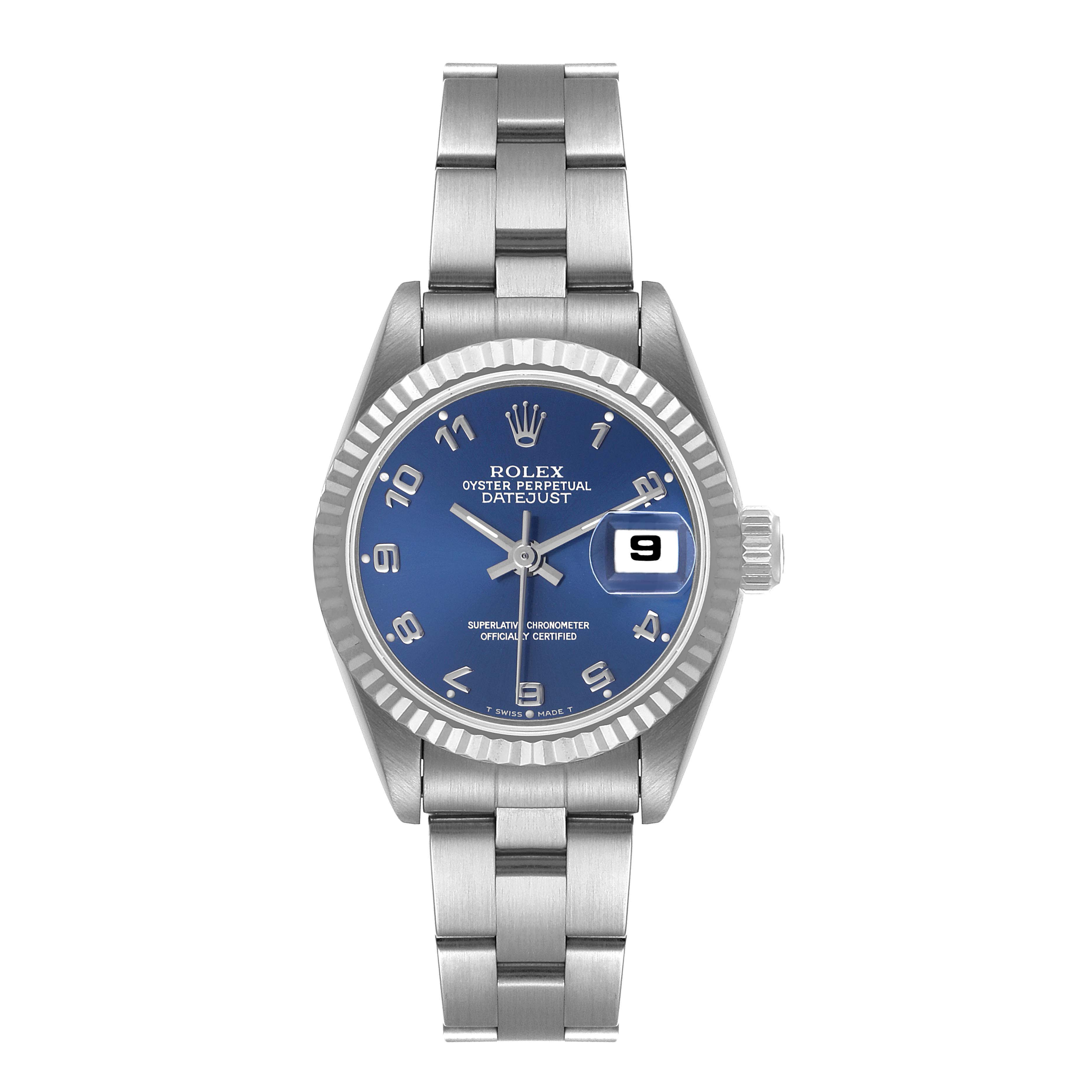 The image shows a Rolex Datejust 69174 Women
s Stainless Steel Blue Dial 69174 Women
s Stainless Steel Blue Dial watch from a top-down angle displaying its blue dial, bezel, crown, and bracelet.