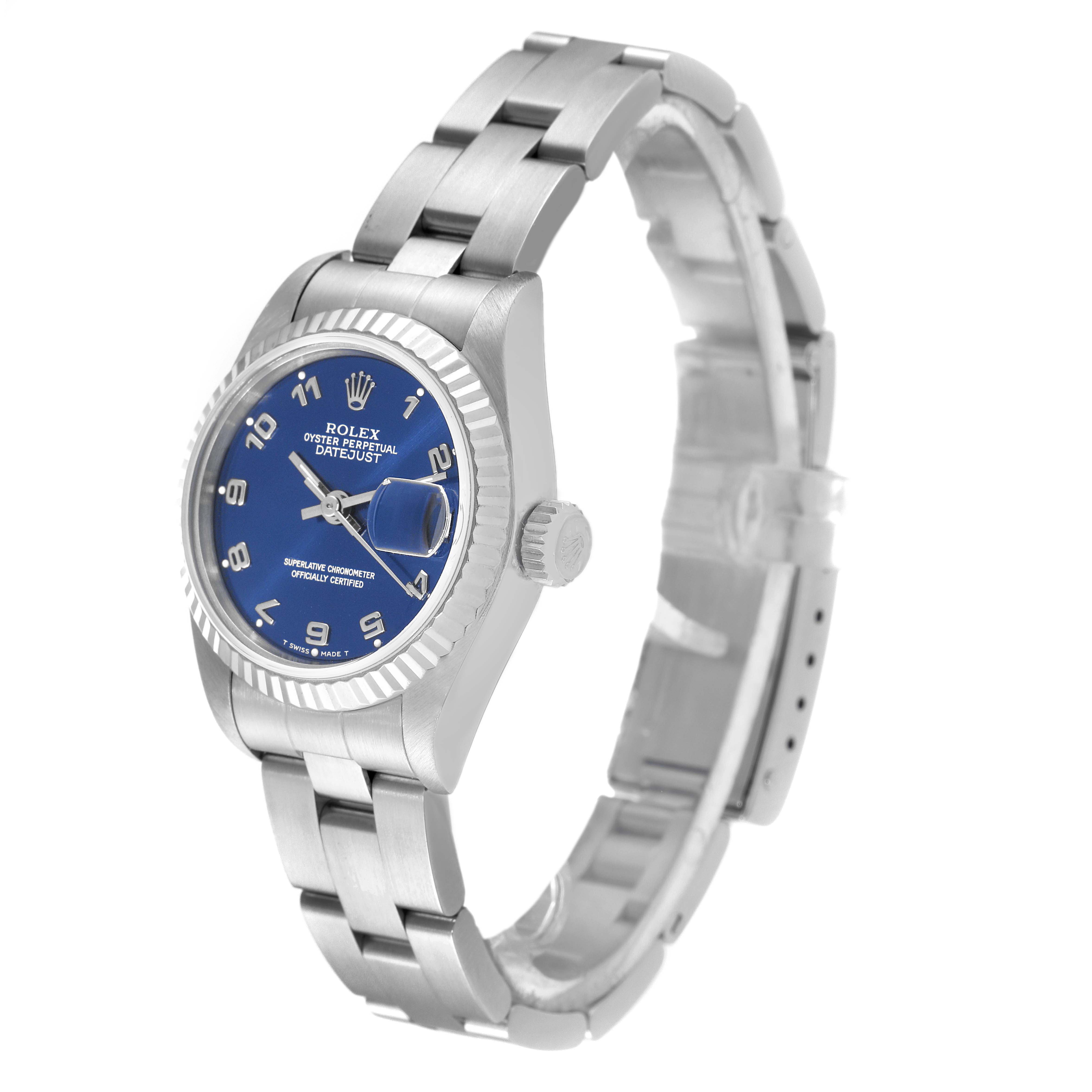 The image shows a Rolex Datejust 69174 Women
s Stainless Steel Blue Dial 69174 Women
s Stainless Steel Blue Dial watch at a slight side angle, highlighting its dial, bezel, crown, and bracelet.