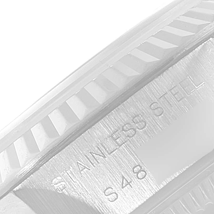 The image shows a close-up of the stainless steel case and fluted bezel of the Rolex Datejust 69174 Women
s Stainless Steel Blue Dial 69174 Women
s Stainless Steel Blue Dial watch.