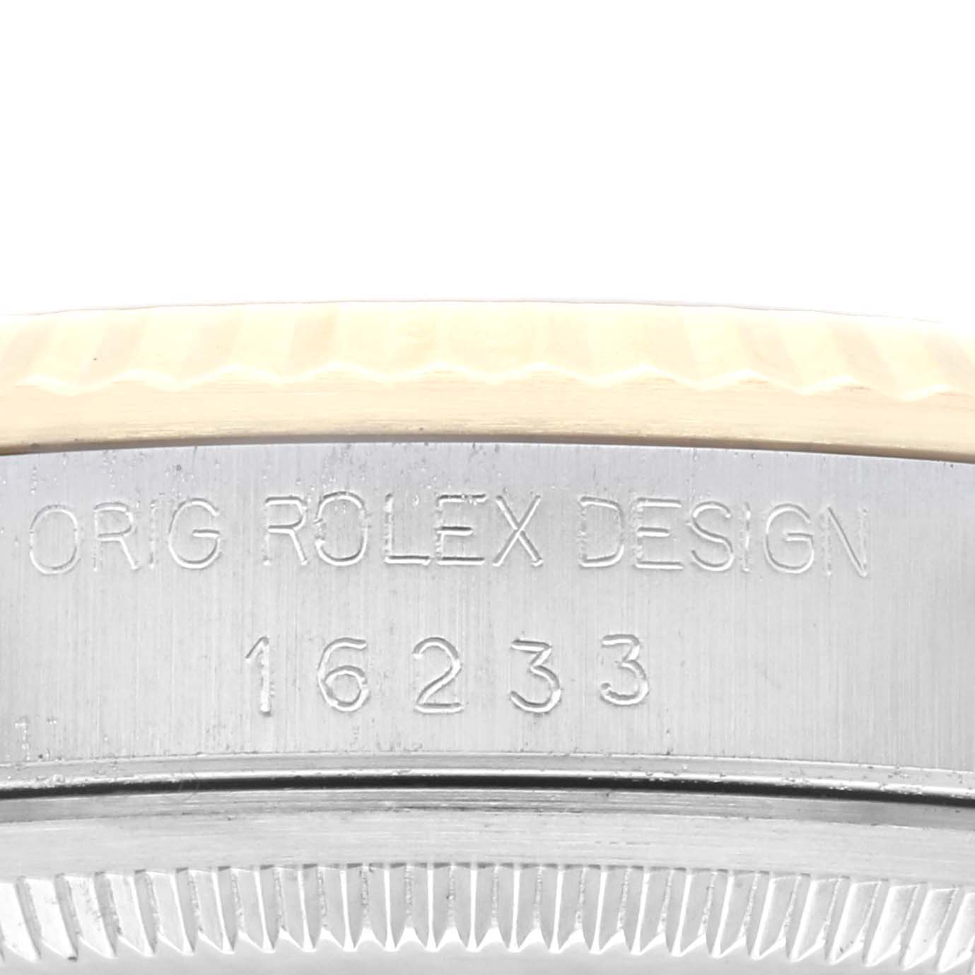 The image shows a close-up of the serial number "16233" and "ORIG ROLEX DESIGN" engraving on the case side of a Rolex Datejust 16233 Men's Steel and Gold (two tone) Champagne Dial 16233 Men's Steel and Gold (two tone) Champagne Dial watch.