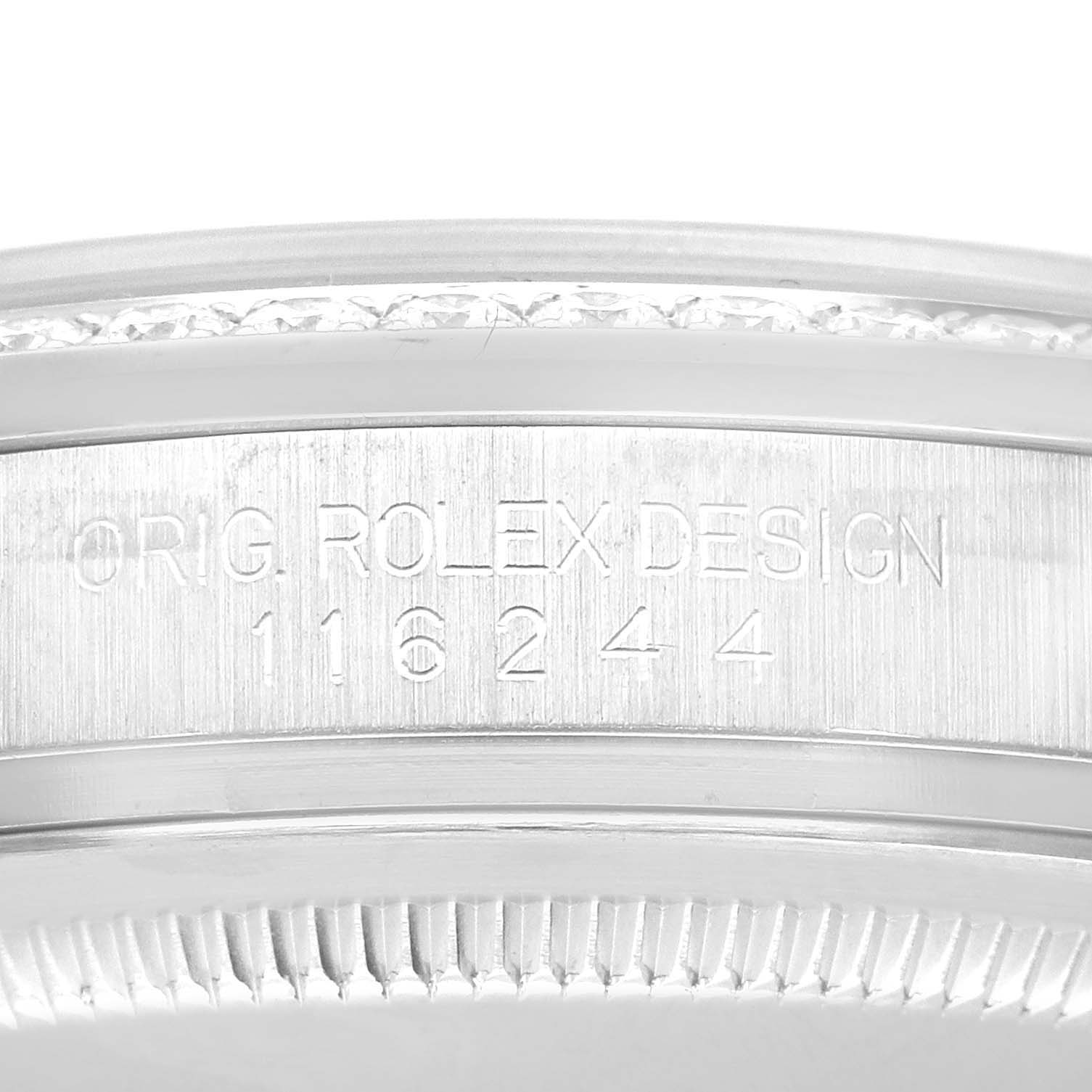 The image shows a close-up view of the bezel and serial number engraving on a Rolex Datejust 116244 Men's Stainless Steel Blue Dial 116244 Men's Stainless Steel Blue Dial watch.