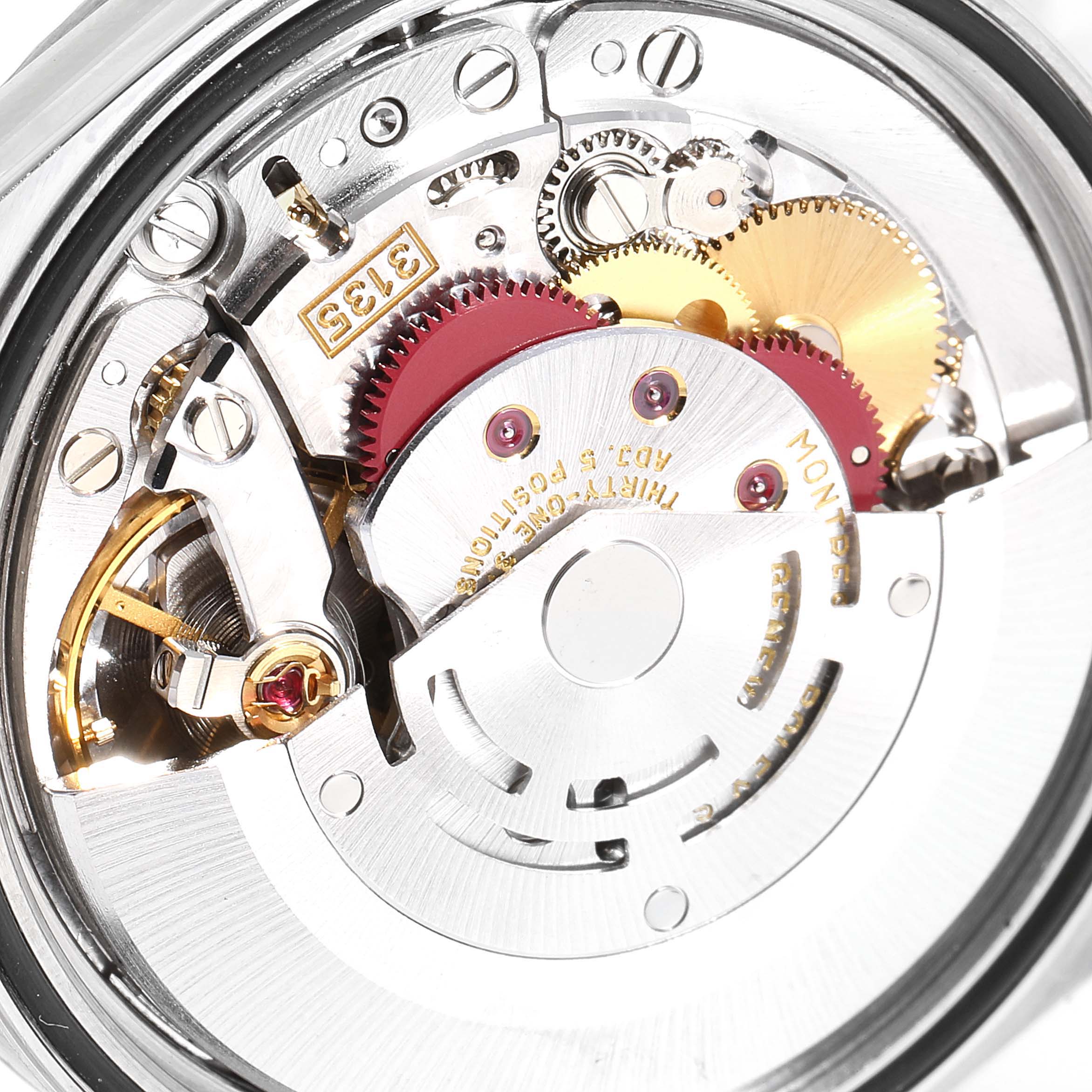 The image shows a close-up of the Rolex Datejust 16234 Men's Stainless Steel Silver Dial 16234 Men's Stainless Steel Silver Dial watch's movement, highlighting intricate gears and mechanisms.