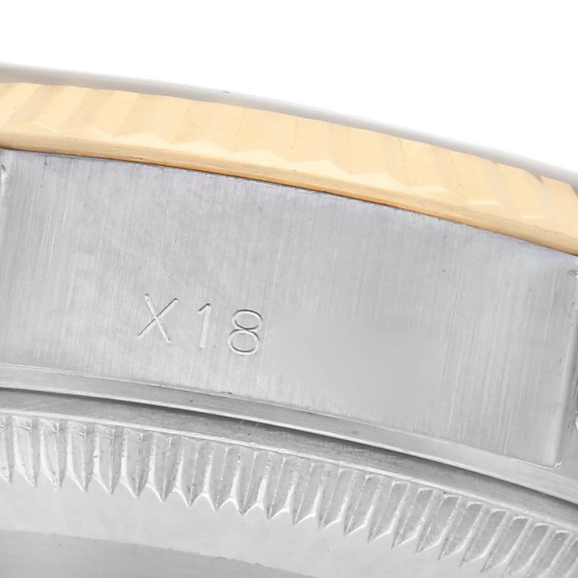 This image shows a close-up view of the side of a Rolex Datejust 69173 Women
s Steel and Gold (two tone) Champagne Dial 69173 Women
s Steel and Gold (two tone) Champagne Dial watch, focusing on the bezel and case markings.
