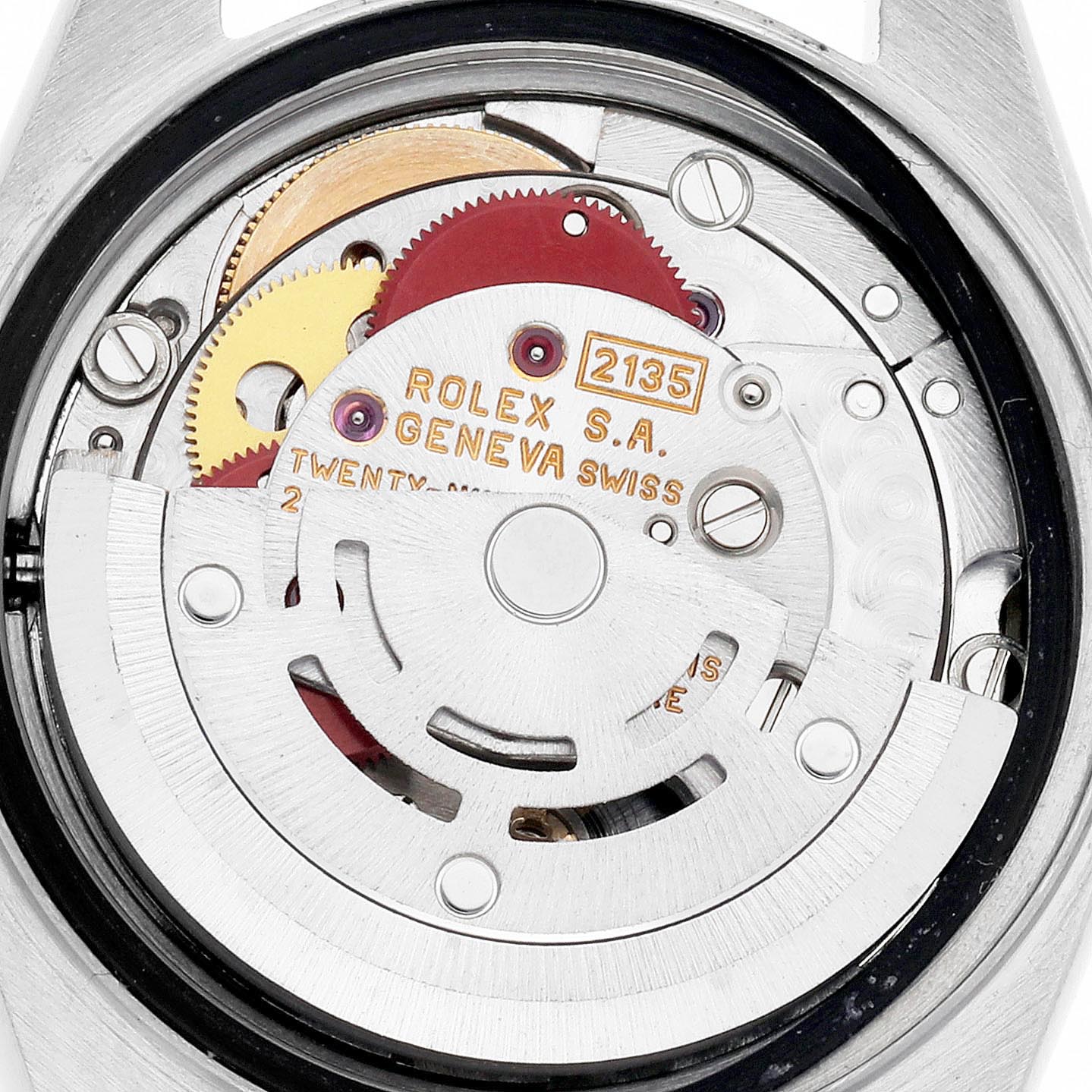 The image shows the movement of a Rolex Datejust 69173 Women
s Steel and Gold (two tone) Champagne Dial 69173 Women
s Steel and Gold (two tone) Champagne Dial, highlighting gears and the rotor from a rear angle view.