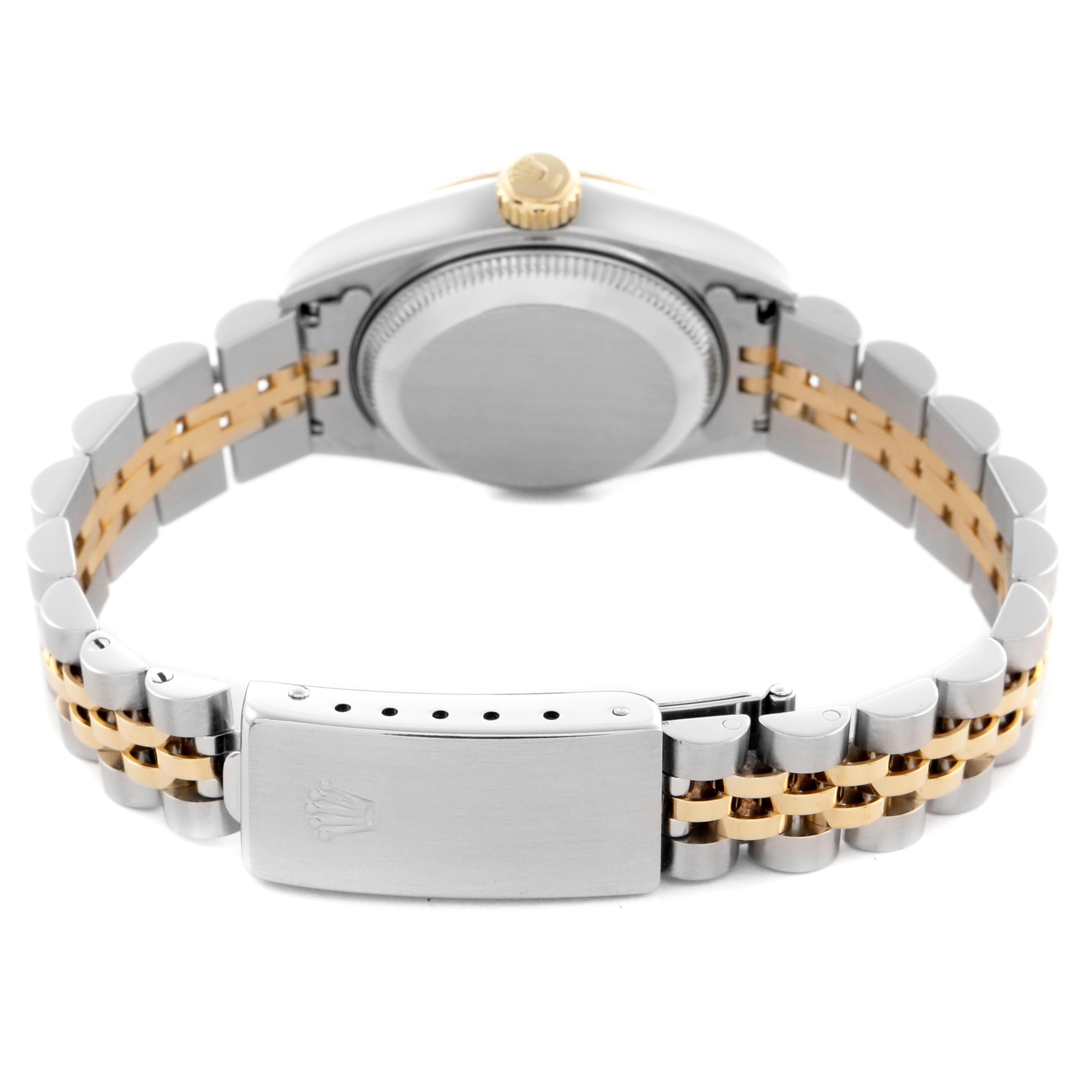 The Rolex Datejust 69173 Women
s Steel and Gold (two tone) Champagne Dial 69173 Women
s Steel and Gold (two tone) Champagne Dial is shown from the back, displaying the case back, crown, and two-tone bracelet with clasp.