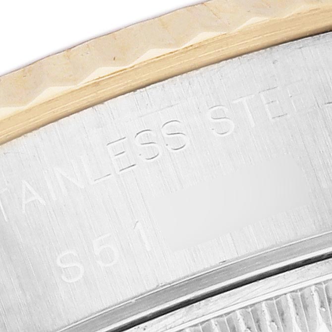 The image shows a close-up of the Rolex Datejust 69173 Women
s Steel and Gold (two tone) Champagne Dial 69173 Women
s Steel and Gold (two tone) Champagne Dial
s case back edge with engraving details visible.