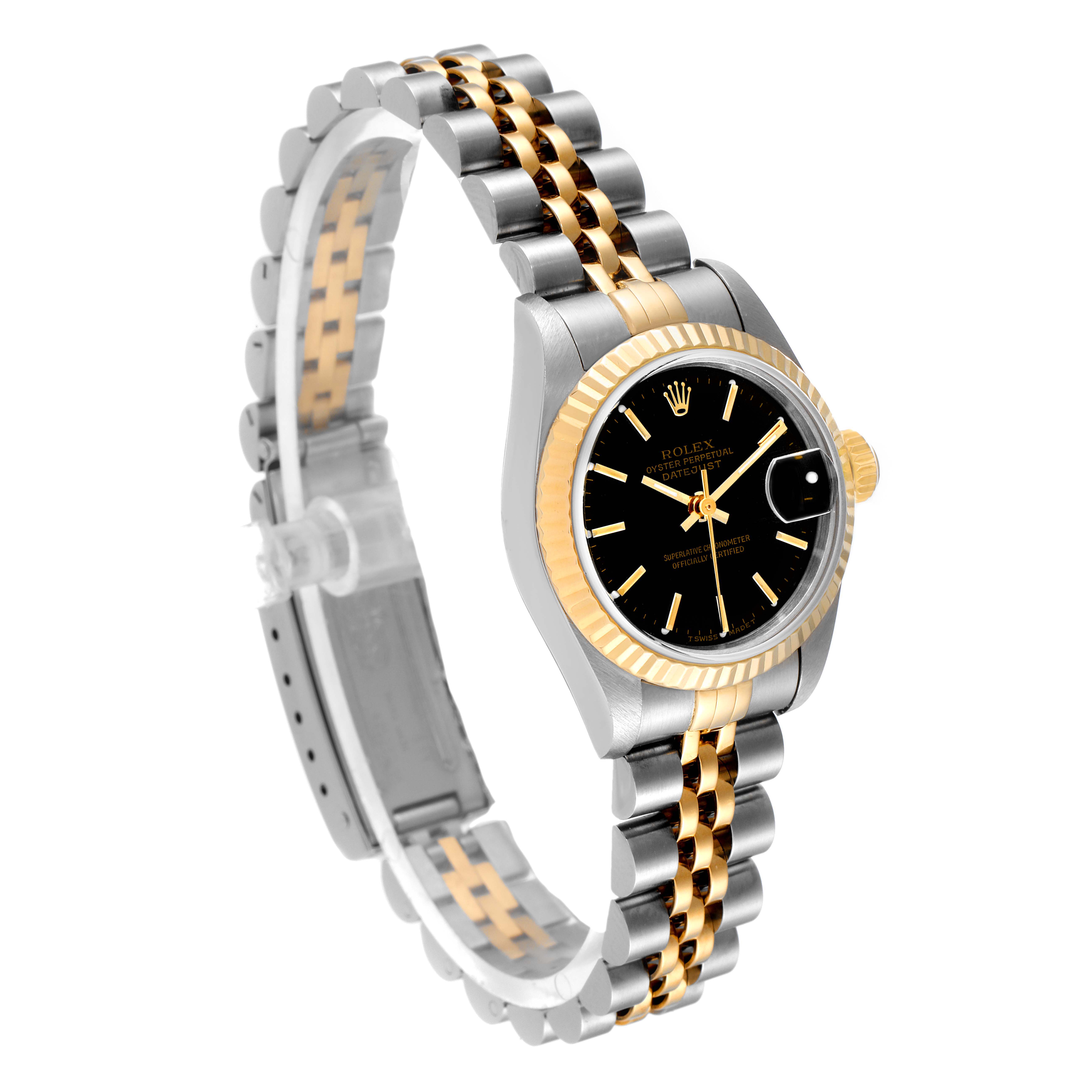 This Rolex Datejust 69173 Women's Stainless Steel Black Dial 69173 Women's Stainless Steel Black Dial watch is angled to show the black dial, gold fluted bezel, and two-tone Jubilee bracelet.