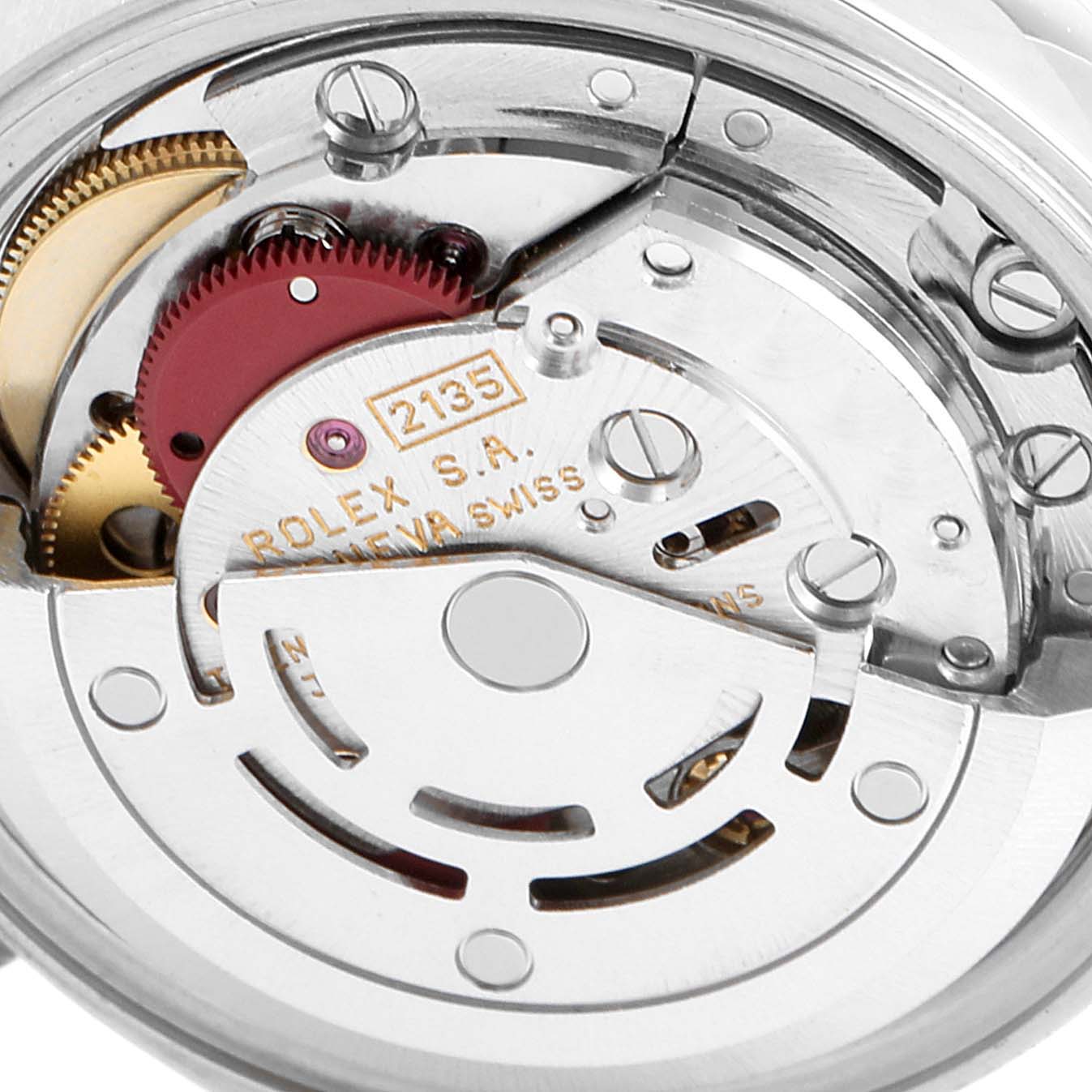 This image shows a close-up of the internal mechanical movement of the Rolex Datejust 69173 Women's Stainless Steel Black Dial 69173 Women's Stainless Steel Black Dial watch, displaying gears and the rotor.