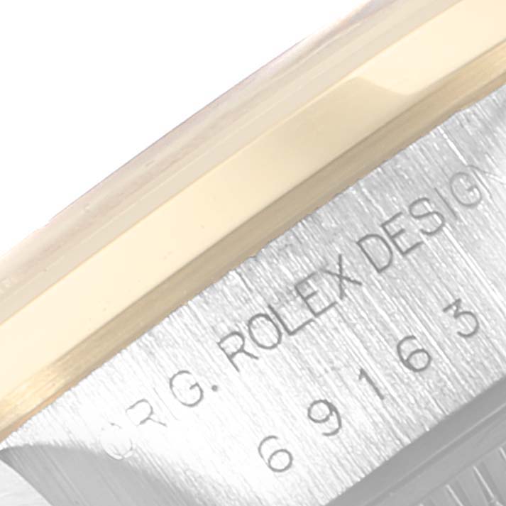 The image shows a close-up of the Rolex Datejust 69163 Women's Stainless Steel Grey Dial 69163 Women's Stainless Steel Grey Dial model, highlighting the case side with "Rolex Design" engraving.