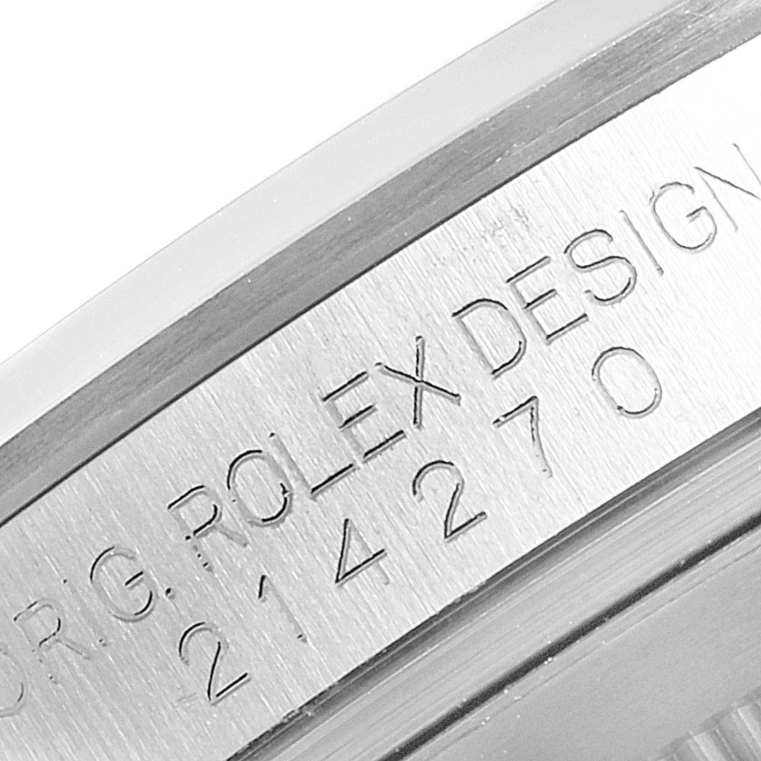 This close-up image shows the casing and engraved serial number of the Rolex Explorer 214270 Men
s Stainless Steel Black Dial 214270 Men
s Stainless Steel Black Dial watch.