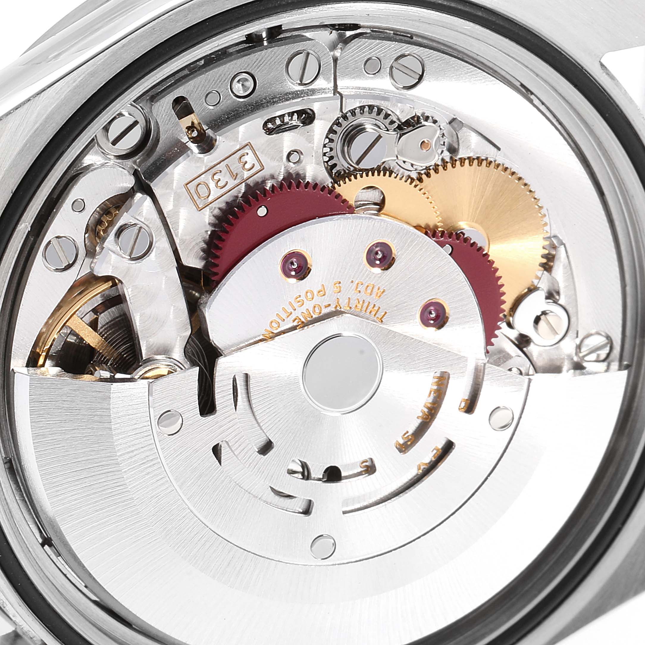 This close-up shot shows the internal mechanism of a Rolex Explorer 114270 Men
s Stainless Steel Black Dial 114270 Men
s Stainless Steel Black Dial watch from the back.