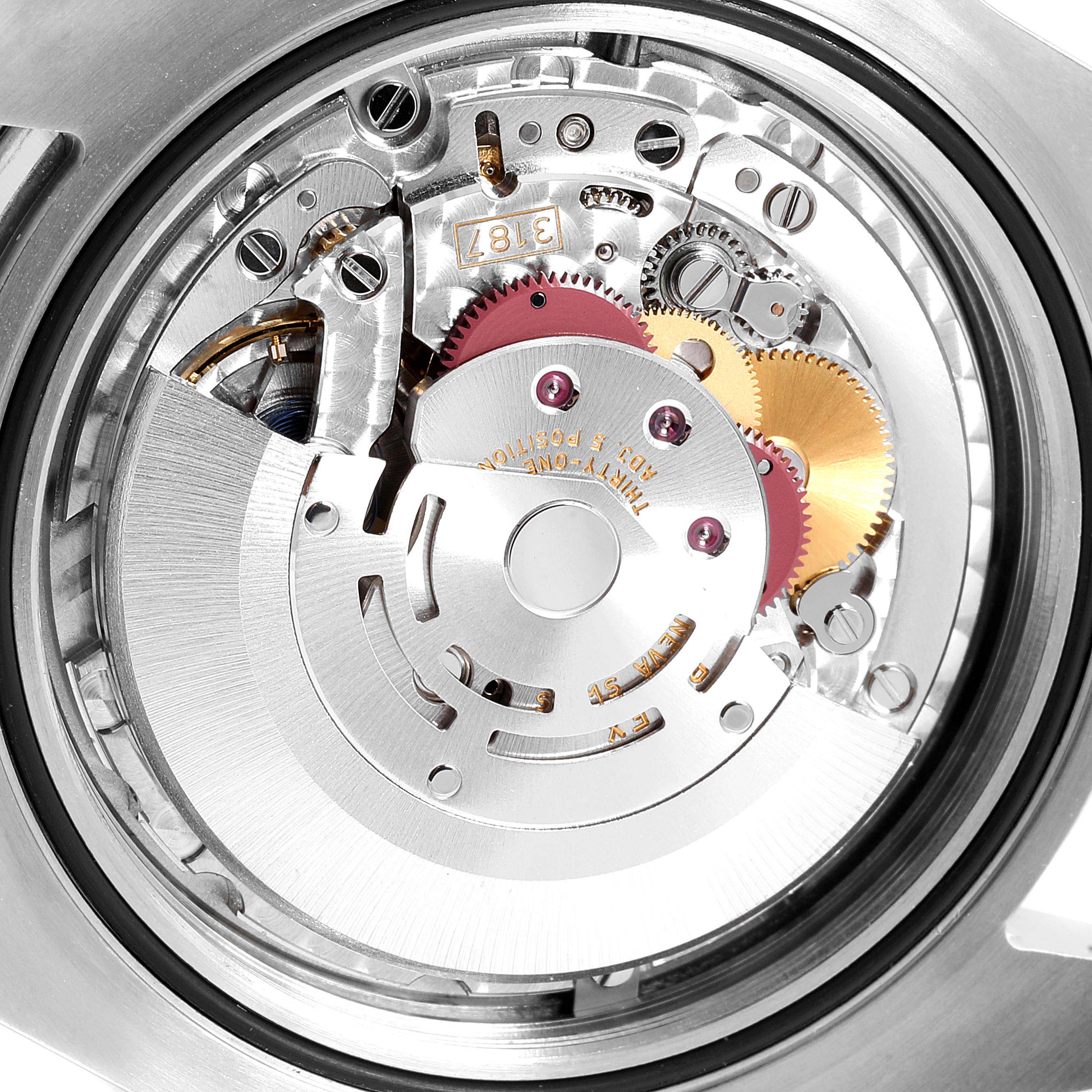 This image shows the intricate internal mechanism of the Rolex Explorer 216570 Men
s Stainless Steel Black Dial 216570 Men
s Stainless Steel Black Dial watch from a close-up angle, highlighting its gears and components.