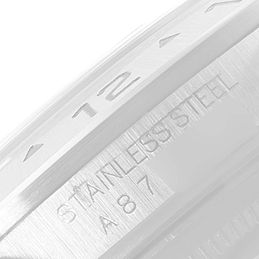 This close-up image of the Rolex Explorer 16570 Men
s Stainless Steel Black Dial 16570 Men
s Stainless Steel Black Dial watch shows the outer bezel and the "stainless steel" engraving.