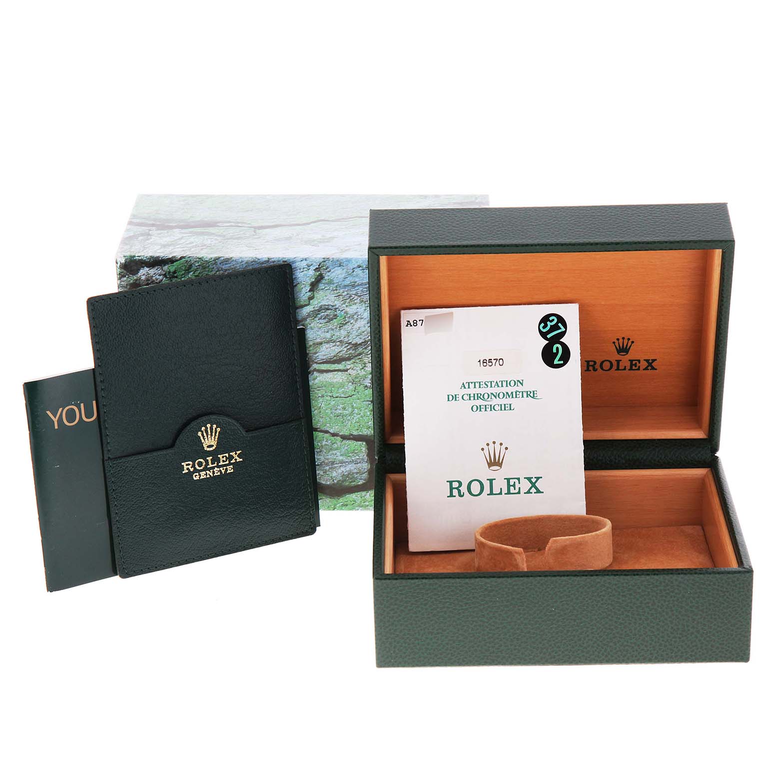 The image shows the packaging and accessories of a Rolex Explorer 16570 Men
s Stainless Steel Black Dial 16570 Men
s Stainless Steel Black Dial watch, including the outer box, inner box, manual, and certification card.