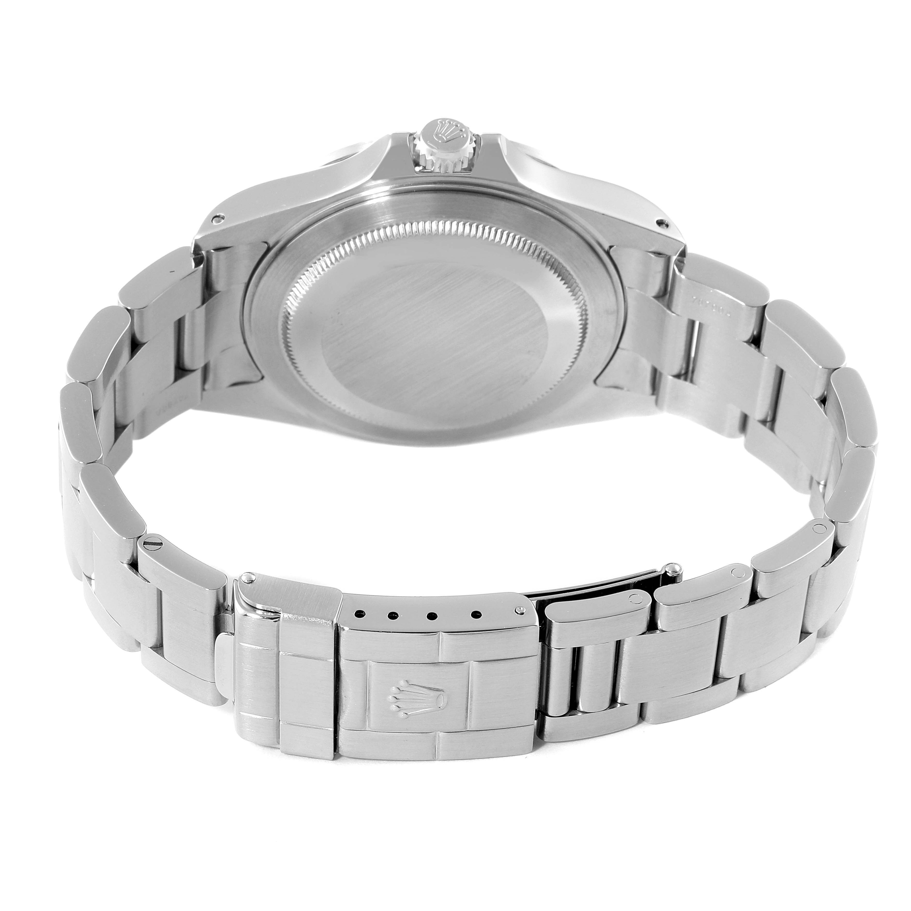 The image shows the back view of a Rolex Explorer 16570 Men
s Stainless Steel Black Dial 16570 Men
s Stainless Steel Black Dial watch, focusing on the case back, crown, and stainless steel bracelet with a clasp.