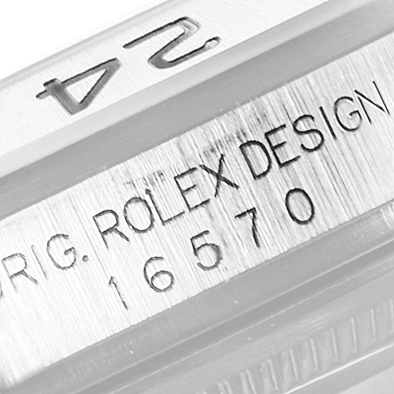 This image shows a close-up of the Rolex Explorer 16570 Men
s Stainless Steel Black Dial 16570 Men
s Stainless Steel Black Dial’s edge with engraved model number and design details.