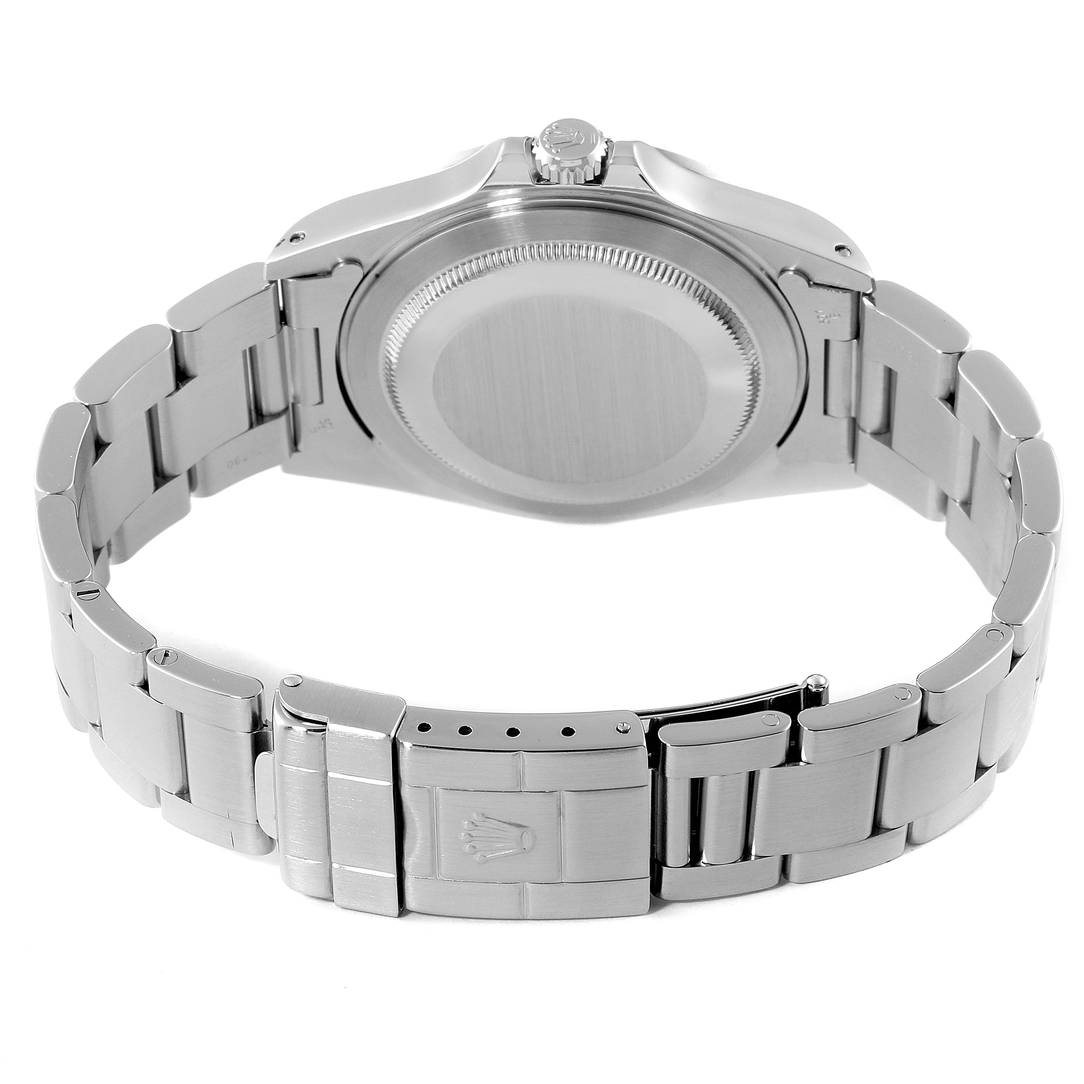 The image shows the backside and clasp of a Rolex Explorer 16570 Men
s Stainless Steel Black Dial 16570 Men
s Stainless Steel Black Dial watch, highlighting its stainless steel bracelet and case back.