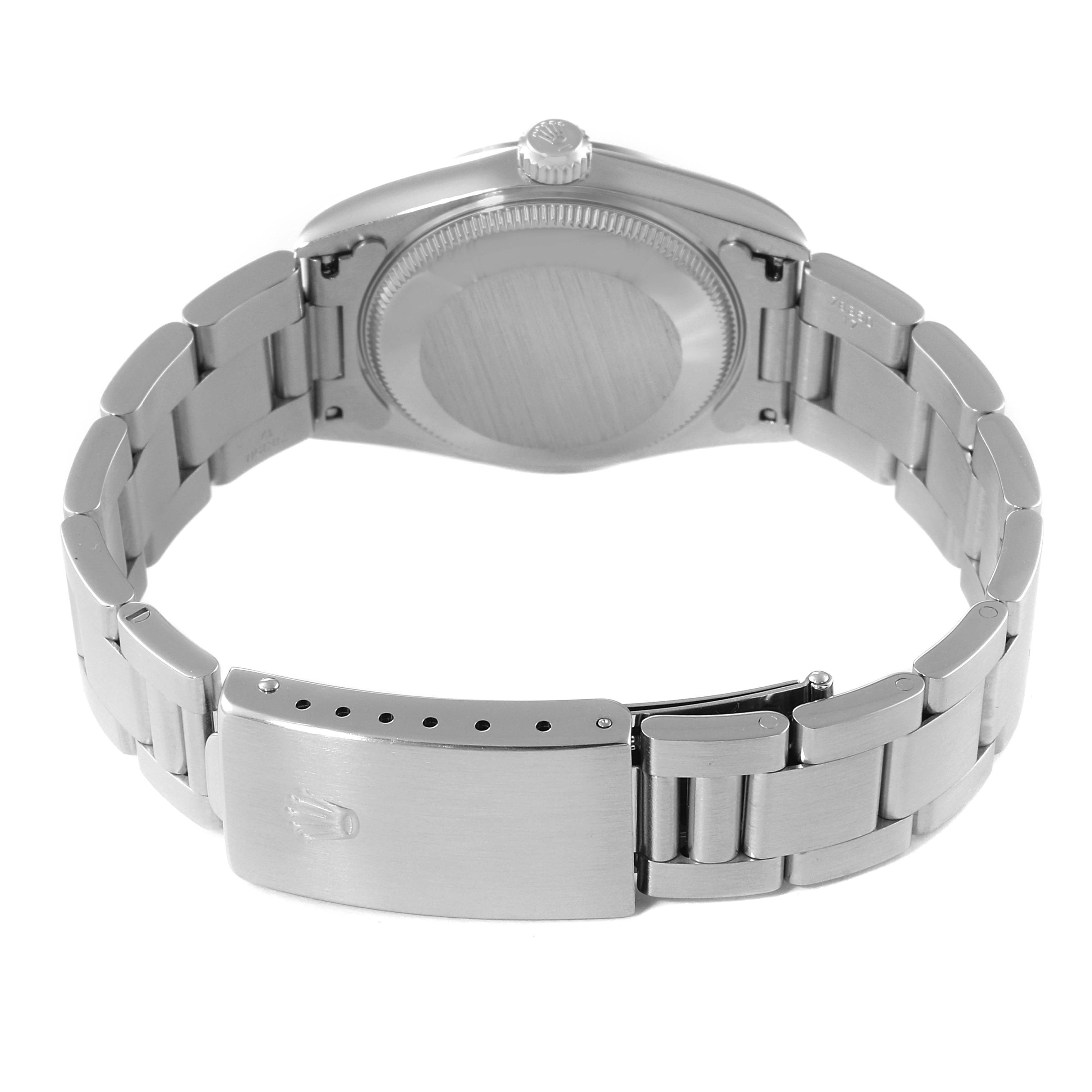 The image shows the back view and bracelet of the Mid-Size Rolex watch.