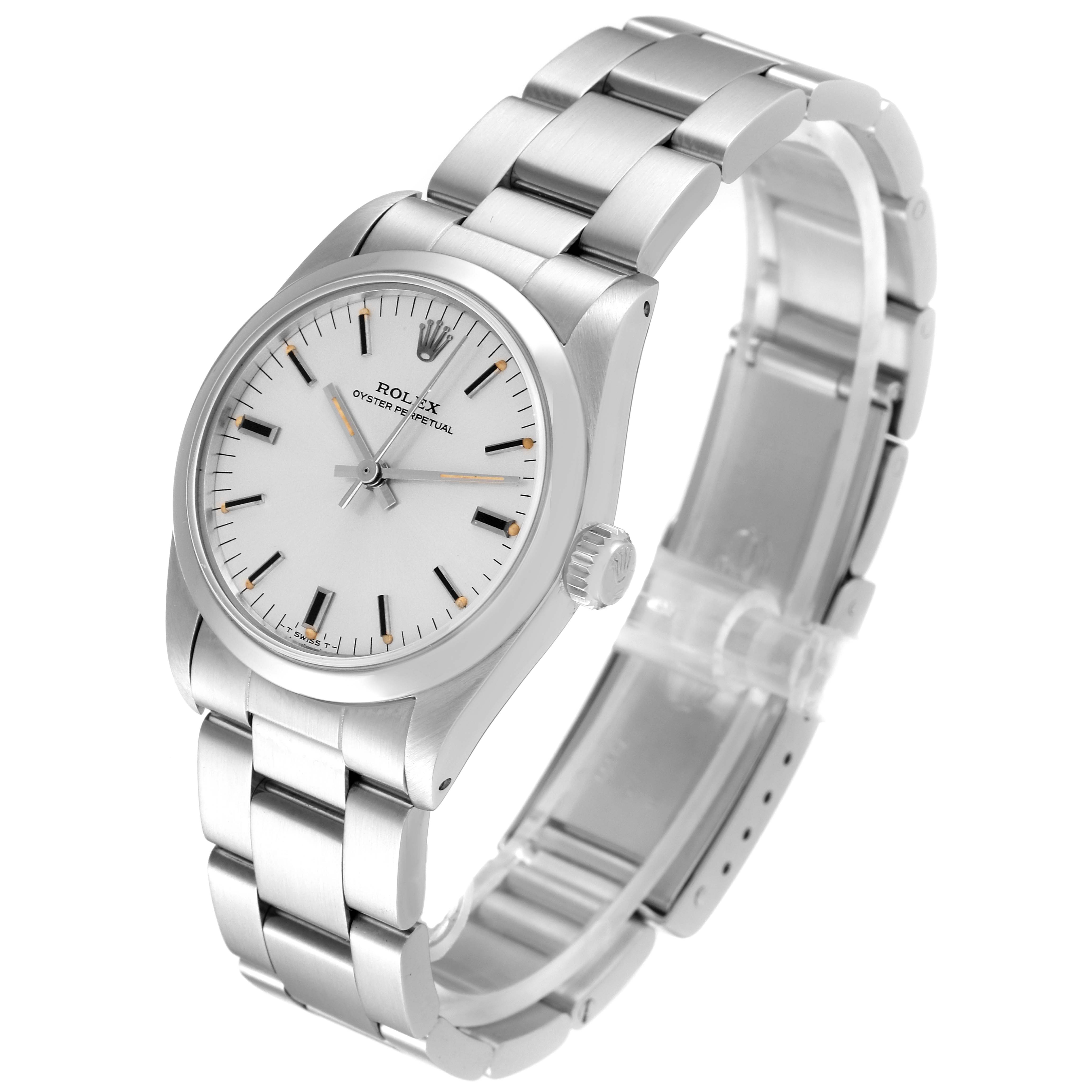 The image shows a Mid-Size Rolex Oyster Perpetual watch from an angled top view, highlighting the dial, case, and bracelet.