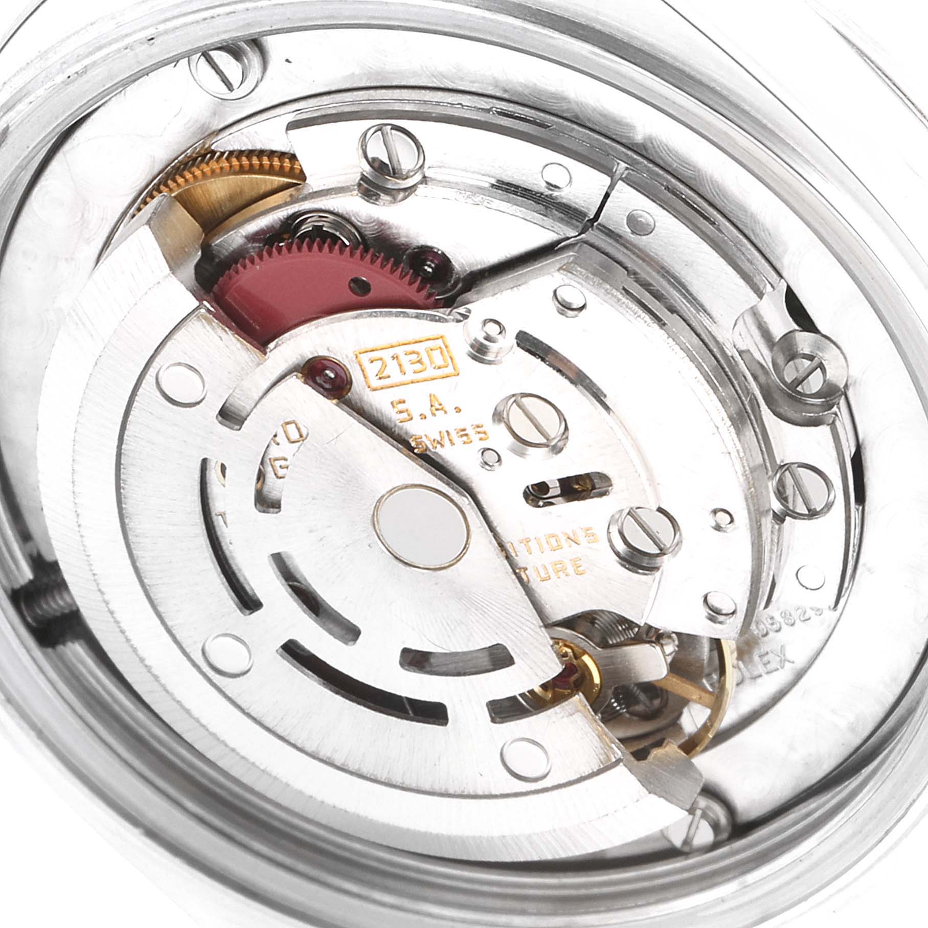 This image shows an up-close view of the movement mechanism inside a Rolex Mid-Size 67480 Women's Stainless Steel Silver Dial 67480 Women's Stainless Steel Silver Dial model watch.
