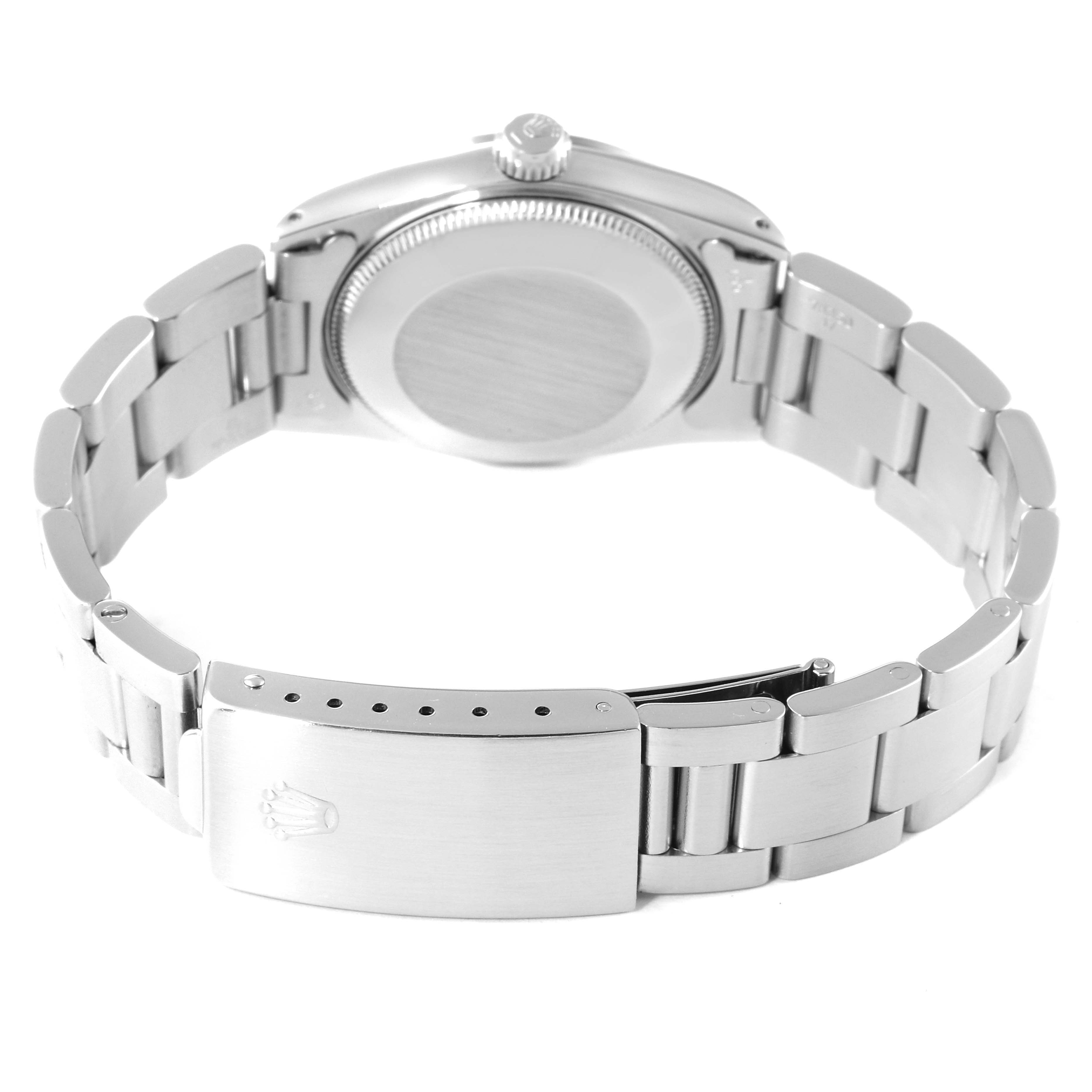 The image shows the back view of a Rolex Mid-Size 67480 Women's Stainless Steel Silver Dial 67480 Women's Stainless Steel Silver Dial model, highlighting the clasp and case back.