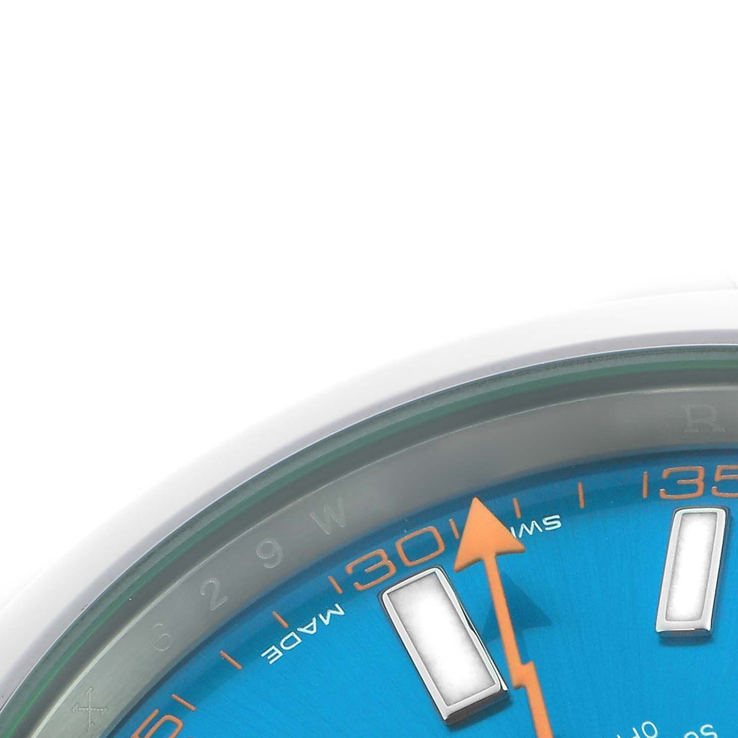 The image shows a detailed close-up of the dial and bezel of a Rolex Milgauss 116400GV Men
s Stainless Steel Blue Dial 116400GV Men
s Stainless Steel Blue Dial watch, highlighting the orange second hand and indices.
