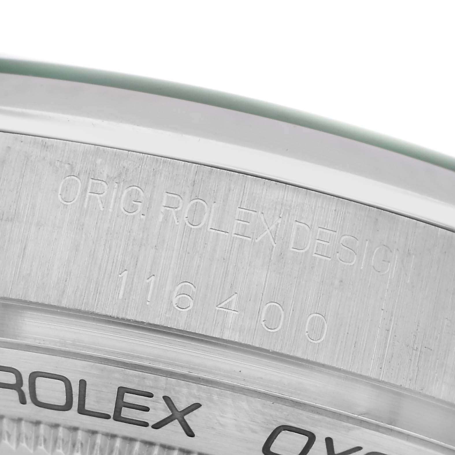 The image shows a close-up of the side engraving on a Rolex Milgauss 116400GV Men
s Stainless Steel Blue Dial 116400GV Men
s Stainless Steel Blue Dial model with the design number visible.