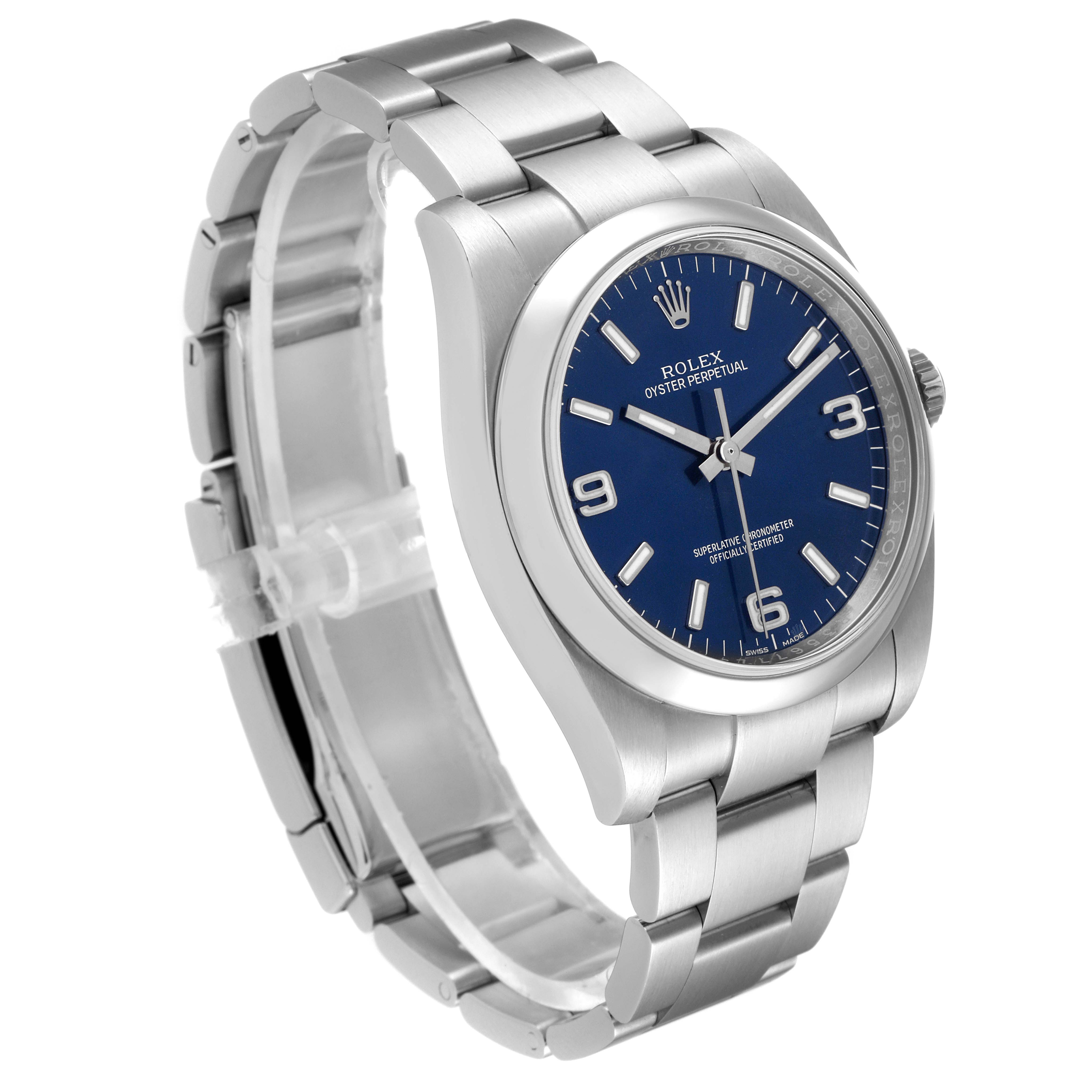 The image shows a Rolex Oyster Perpetual 116000 Men's Stainless Steel Blue Dial 116000 Men's Stainless Steel Blue Dial watch from an angled front-side view, displaying the blue dial and stainless steel bracelet.
