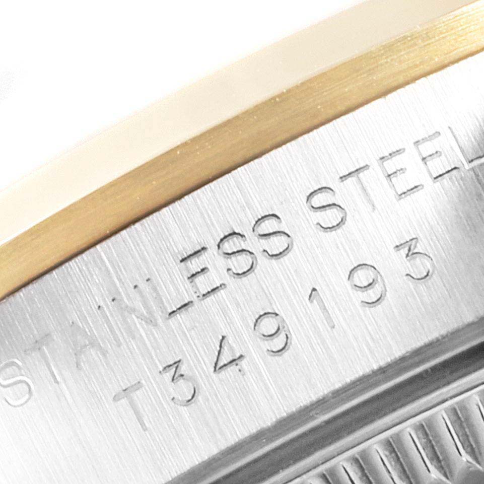 The image shows a close-up of the engraved stainless steel on the side of a Rolex Oyster Perpetual 67183 Women's Steel and Gold (two tone) Grey Dial 67183 Women's Steel and Gold (two tone) Grey Dial watch.