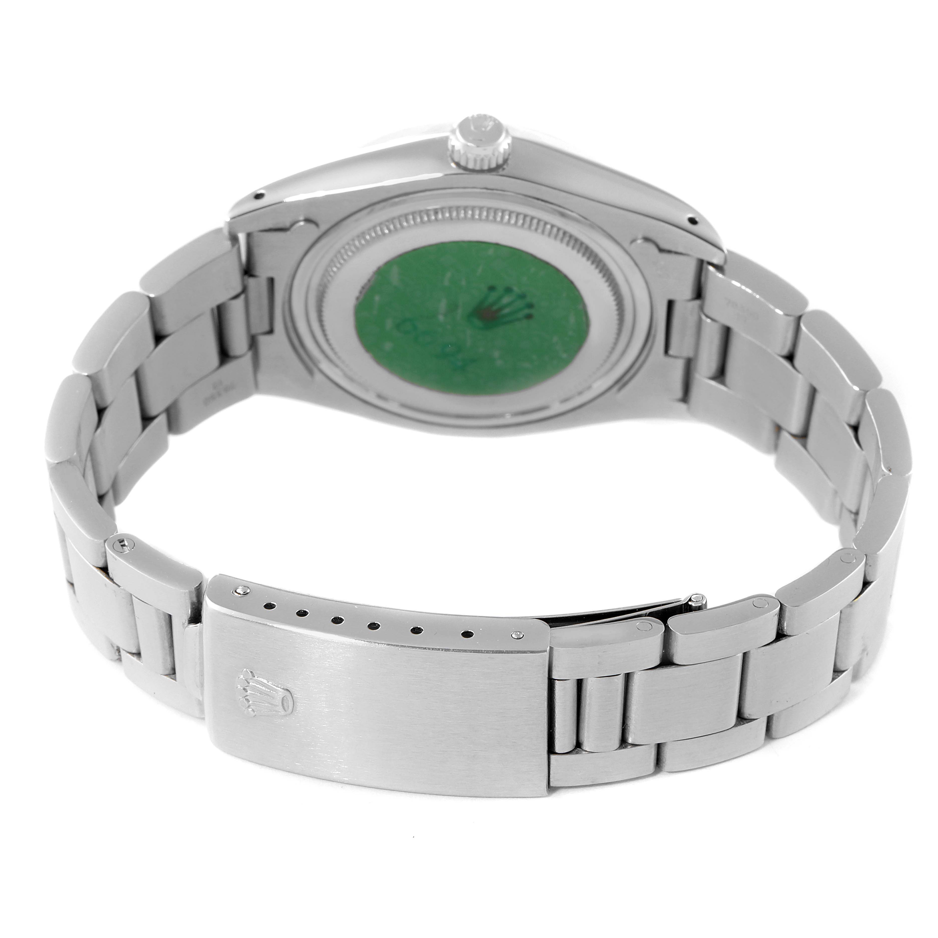 The image shows the back case and bracelet clasp of a Rolex Date 6694 Men's Stainless Steel Black Dial 6694 Men's Stainless Steel Black Dial watch.