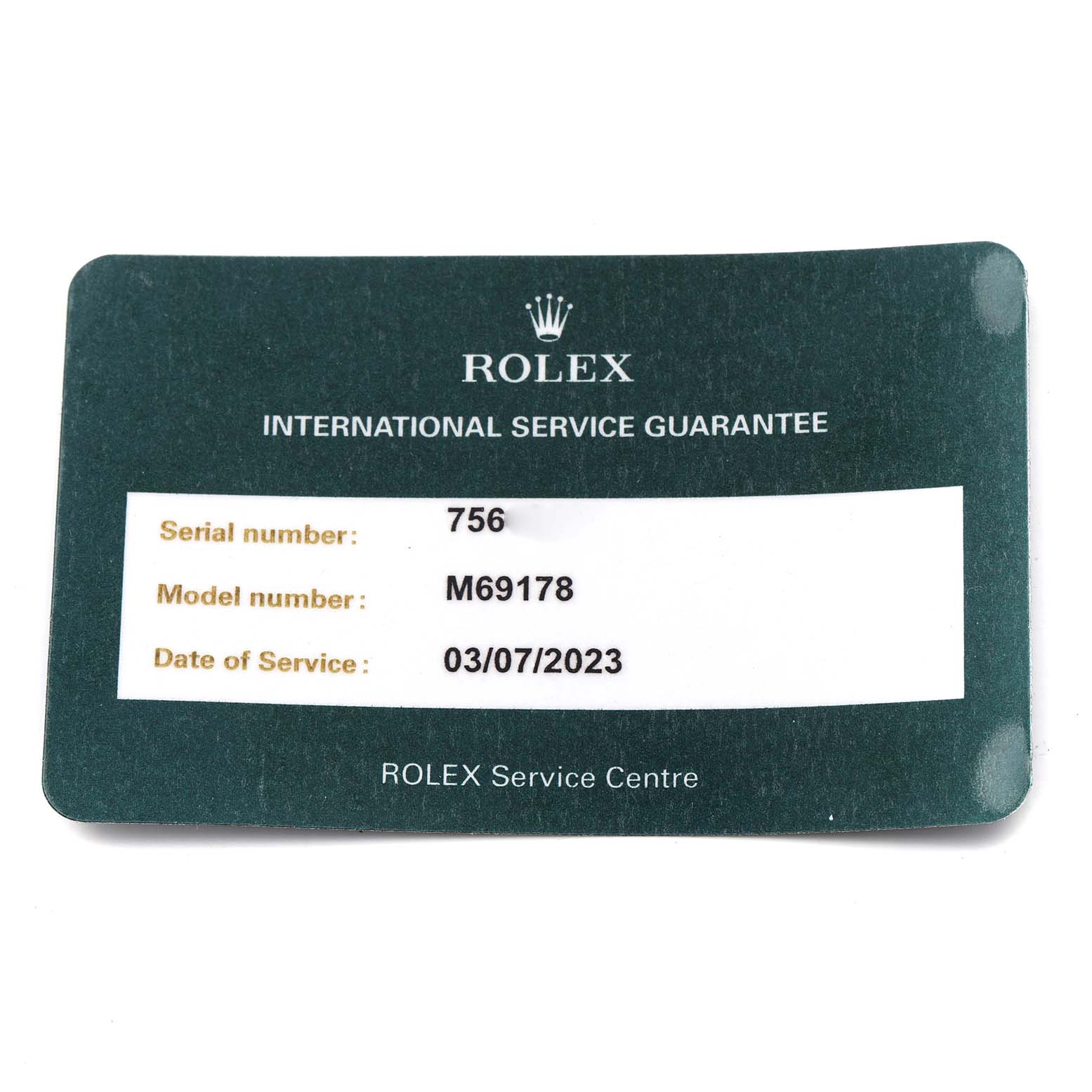The image shows a Rolex International Service Guarantee card for the President model M69178.