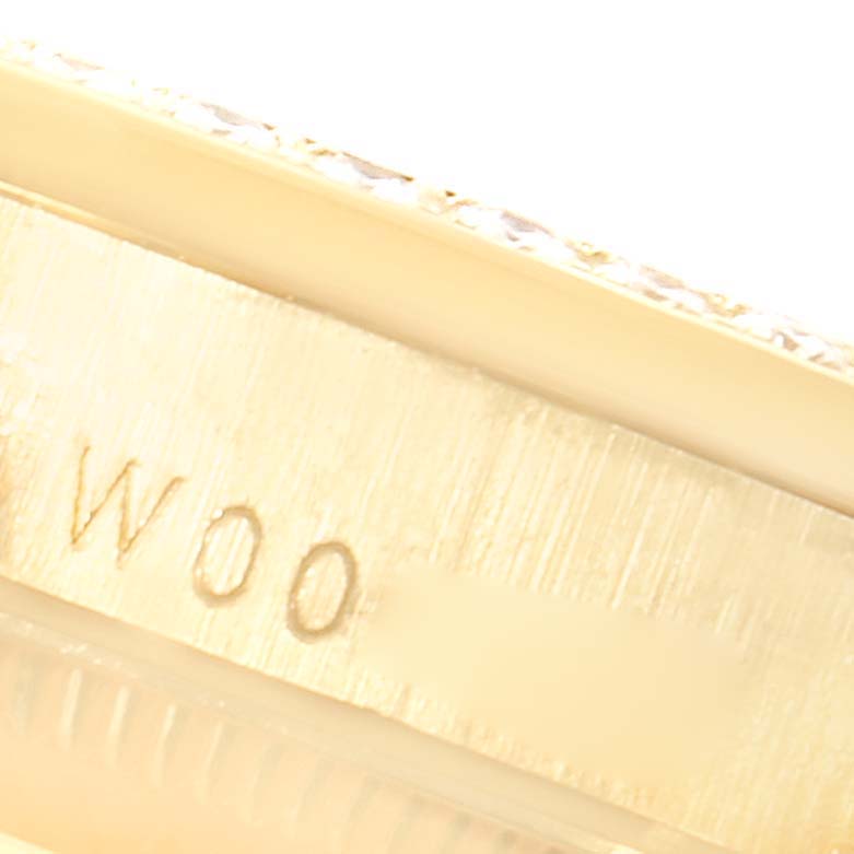 This is a close-up angle of the side of a Rolex President 68158 Women
s Yellow Gold Champagne Dial 68158 Women
s Yellow Gold Champagne Dial model, showing engraved text.