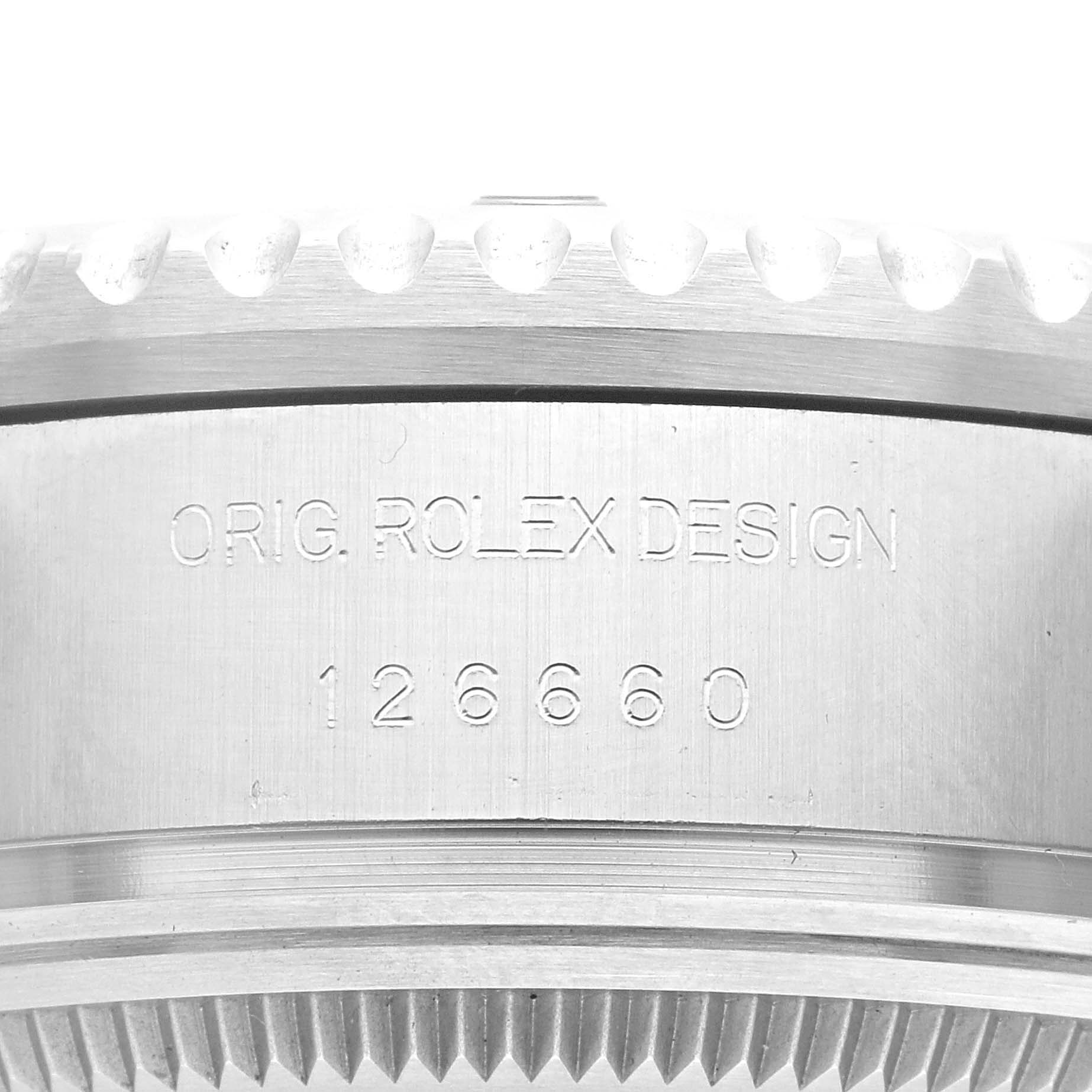The image shows a close-up of the case side of a Rolex Sea-Dweller 126660 Men
s Stainless Steel Black Dial 126660 Men
s Stainless Steel Black Dial, featuring the engraving "ORIG. ROLEX DESIGN 126660".