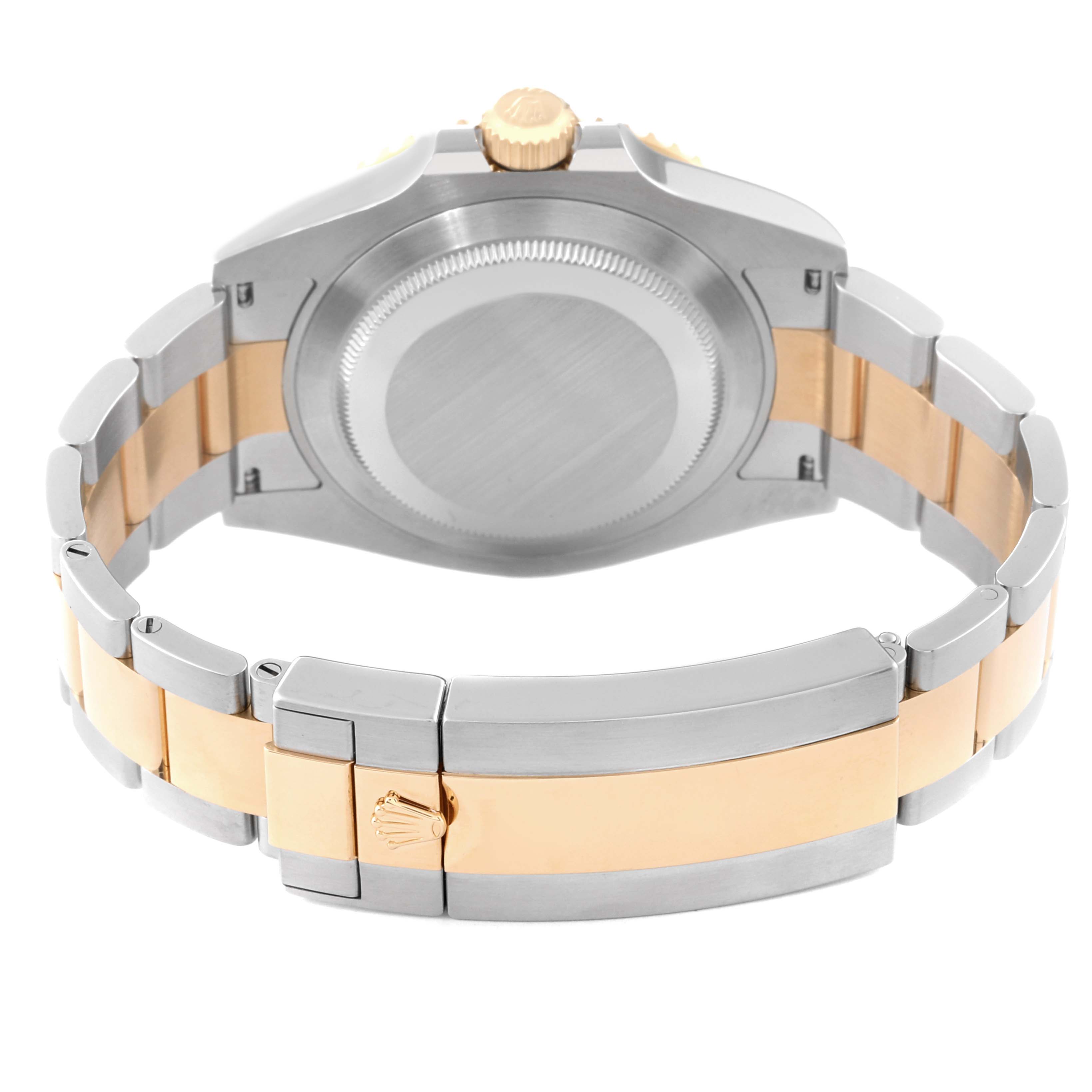 This image shows the back of a Rolex Submariner 126613LB Men's Steel and Gold (two tone) Blue Dial 126613LB Men's Steel and Gold (two tone) Blue Dial watch, highlighting the case, crown, and two-tone bracelet.