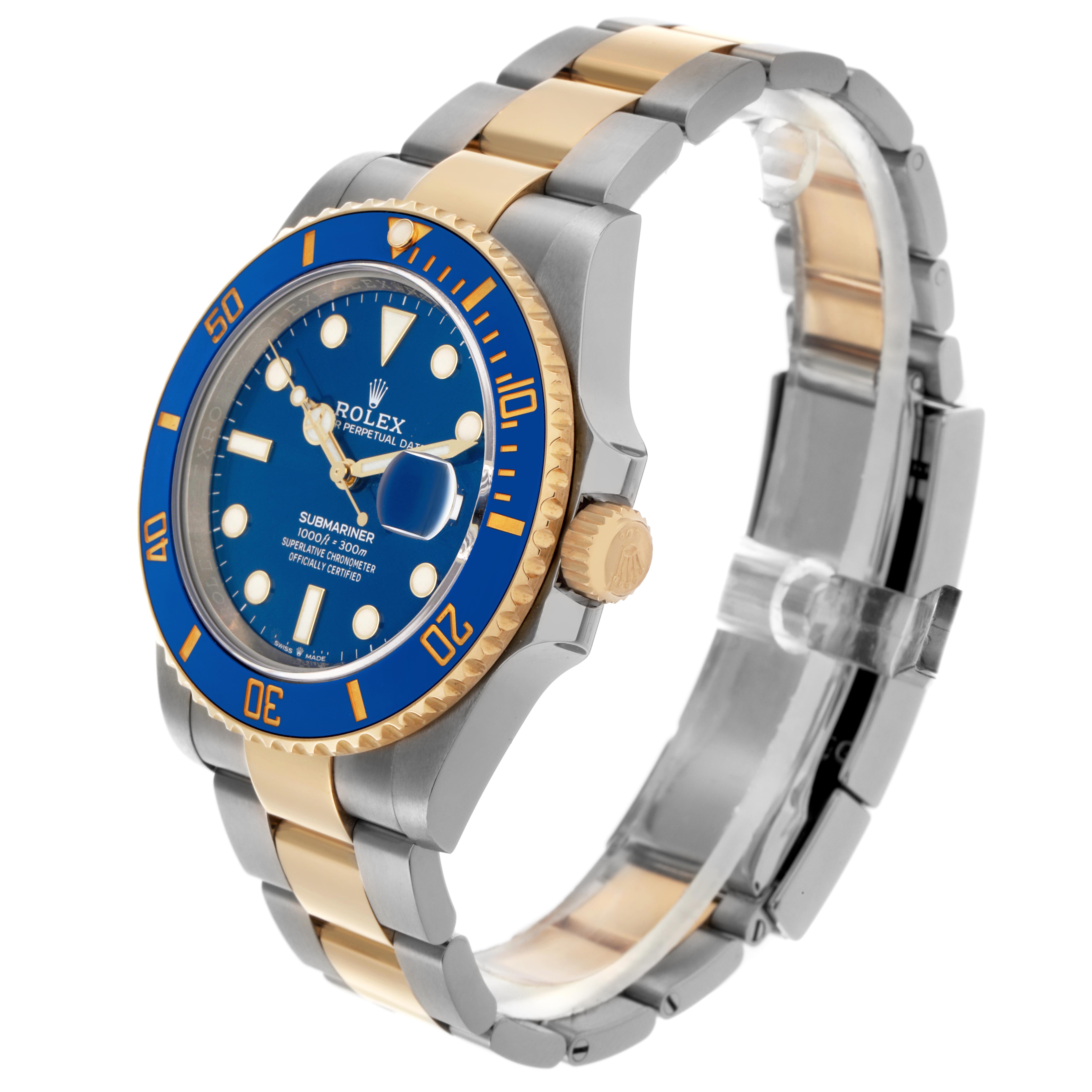 The Rolex Submariner 126613 Men
s Steel and Gold (two tone) Blue Dial 126613 Men
s Steel and Gold (two tone) Blue Dial is shown at a side angle, highlighting the blue dial, bezel, and two-tone bracelet.