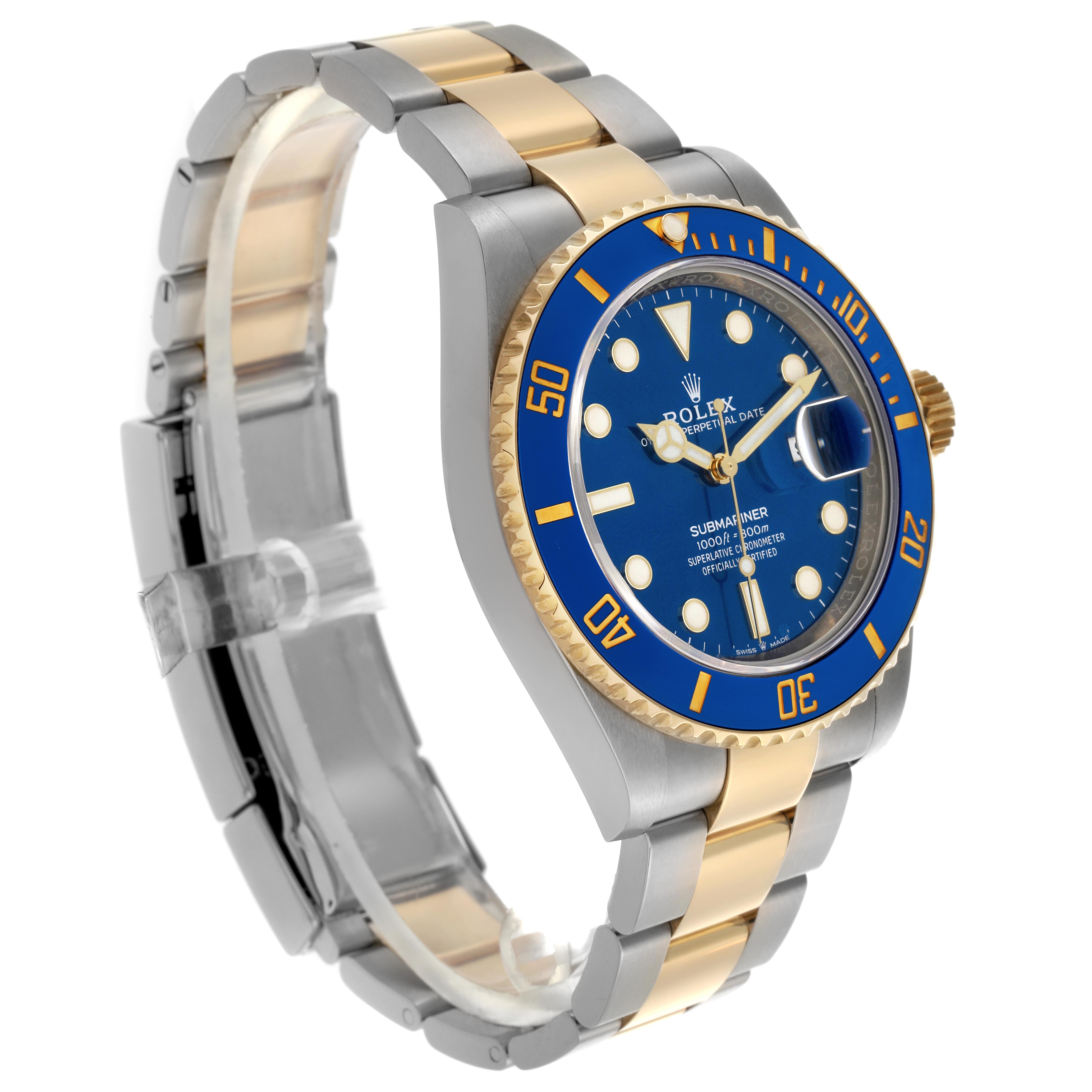 The Rolex Submariner 126613 Men
s Steel and Gold (two tone) Blue Dial 126613 Men
s Steel and Gold (two tone) Blue Dial watch is shown at a three-quarter angle, displaying the face, bezel, bracelet, and side of the case.