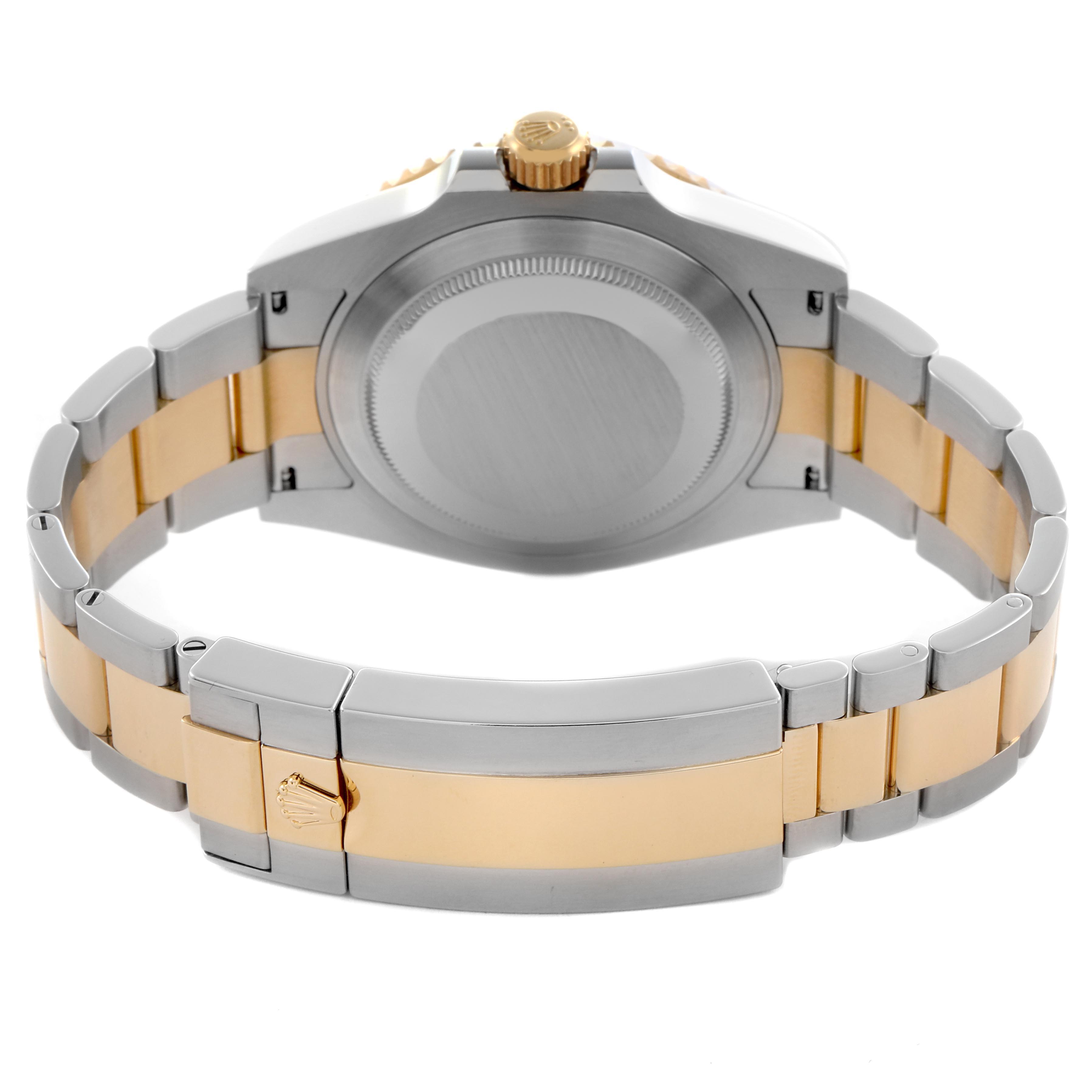 The image shows the back view of a Rolex Submariner 126613 Men
s Steel and Gold (two tone) Blue Dial 126613 Men
s Steel and Gold (two tone) Blue Dial, focusing on the bracelet and case back.