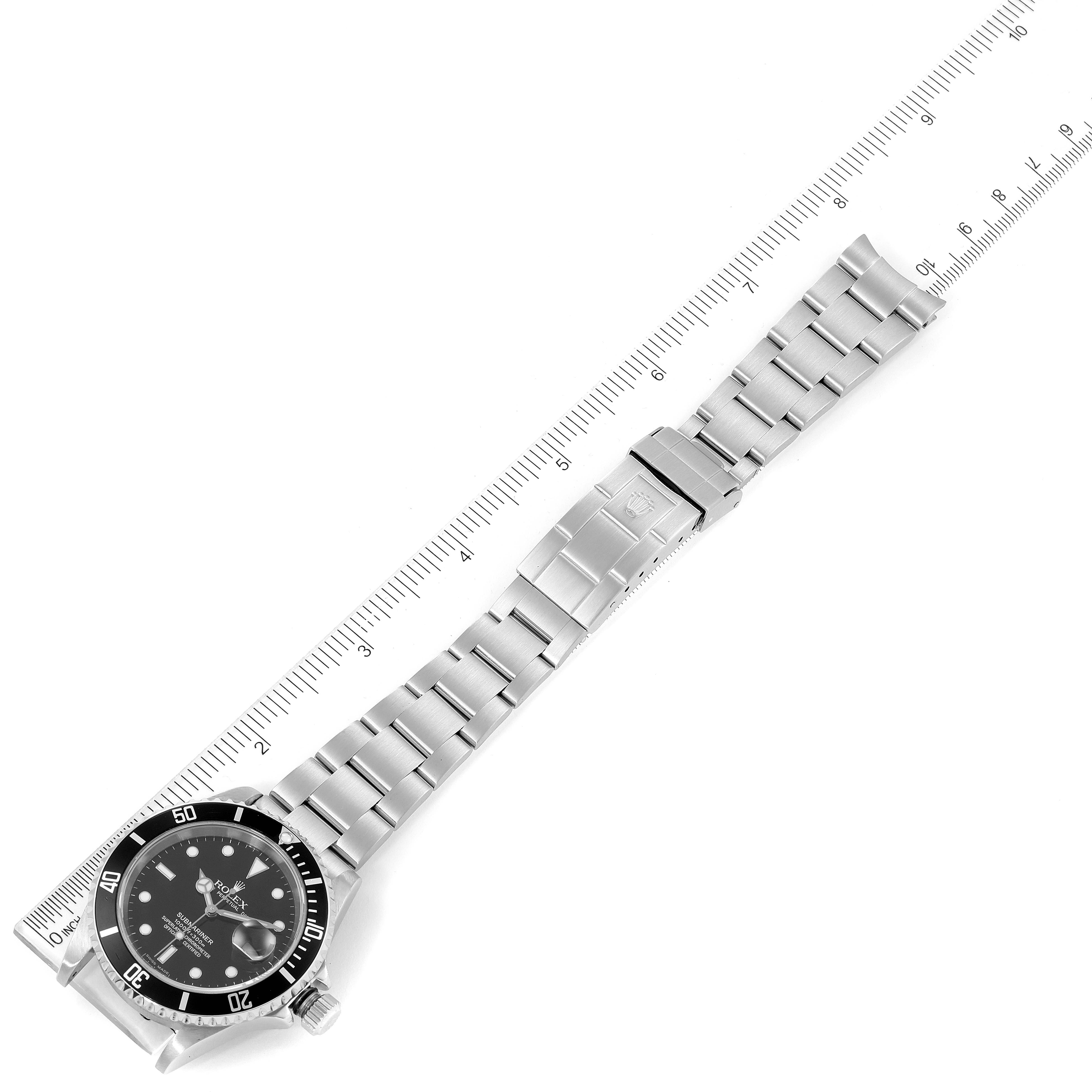 The image shows a top-down view of a Rolex Submariner 16610 Men
s Stainless Steel Black Dial 16610 Men
s Stainless Steel Black Dial watch, including the face, bezel, and extended metal bracelet.