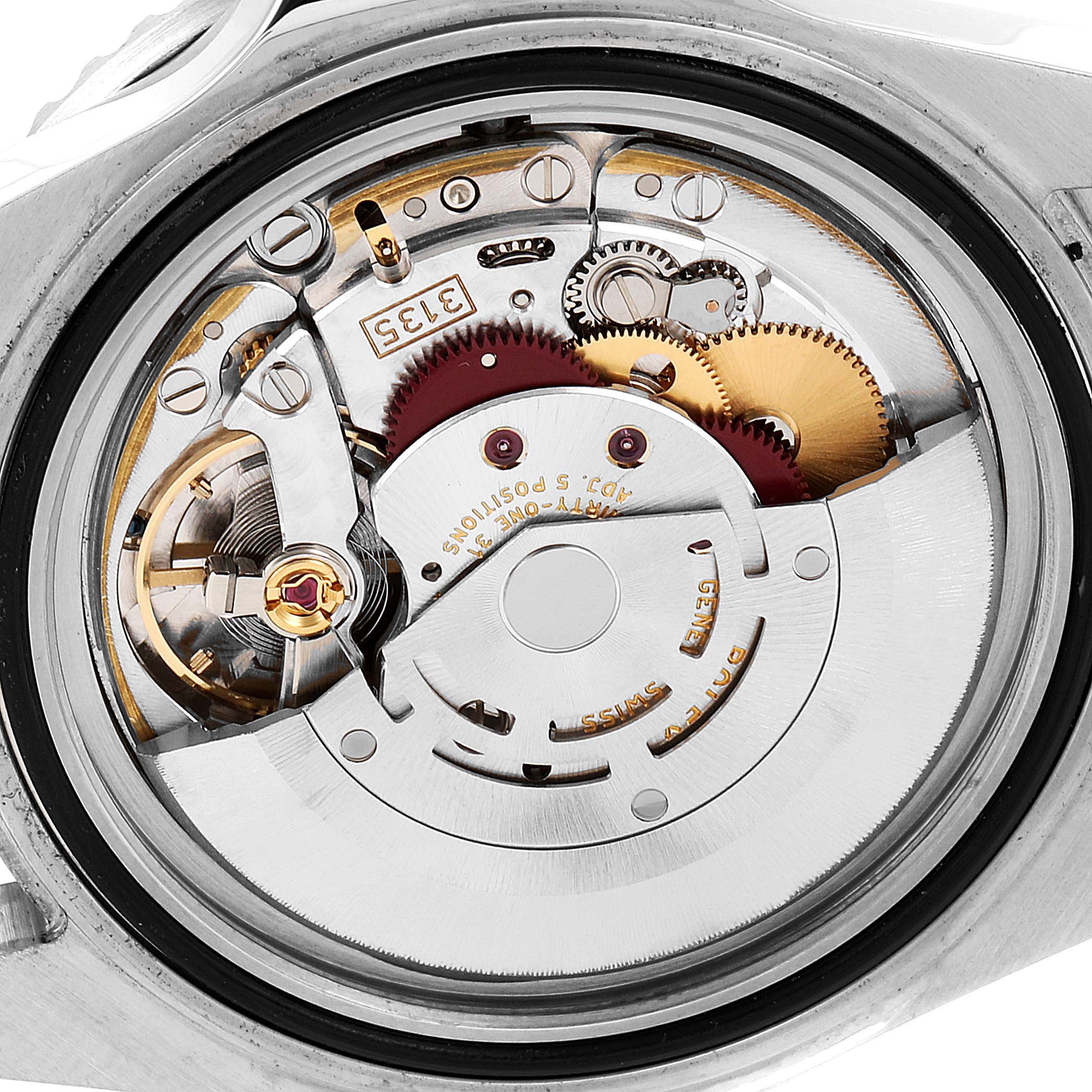 This image shows the movement mechanism of a Rolex Submariner 16610 Men's Stainless Steel Black Dial 16610 Men's Stainless Steel Black Dial watch from a rear angle with its case back removed.