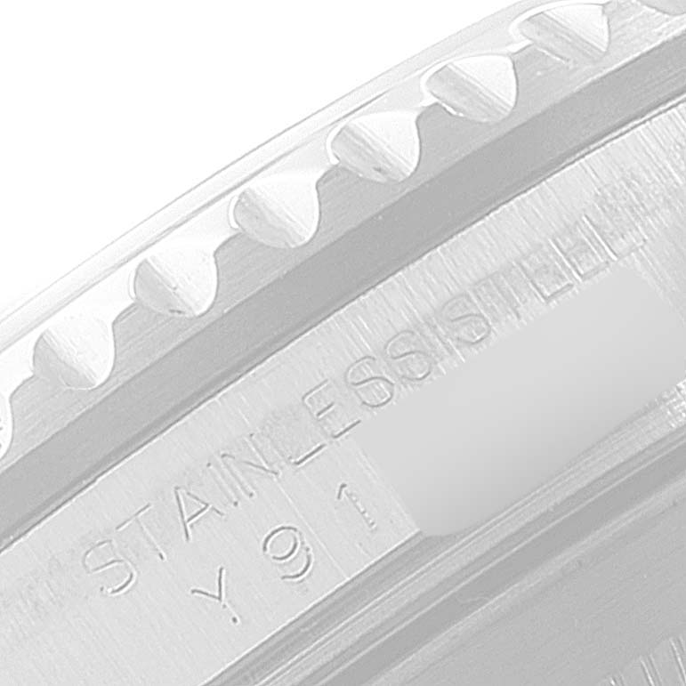 This image shows a close-up of the stainless steel case and the engraved serial number of a Rolex Submariner 16610 Men
s Stainless Steel Black Dial 16610 Men
s Stainless Steel Black Dial.