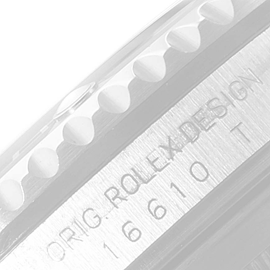 This close-up shows the case side of a Rolex Submariner 16610 Men
s Stainless Steel Black Dial 16610 Men
s Stainless Steel Black Dial, specifically the serial and design numbers.