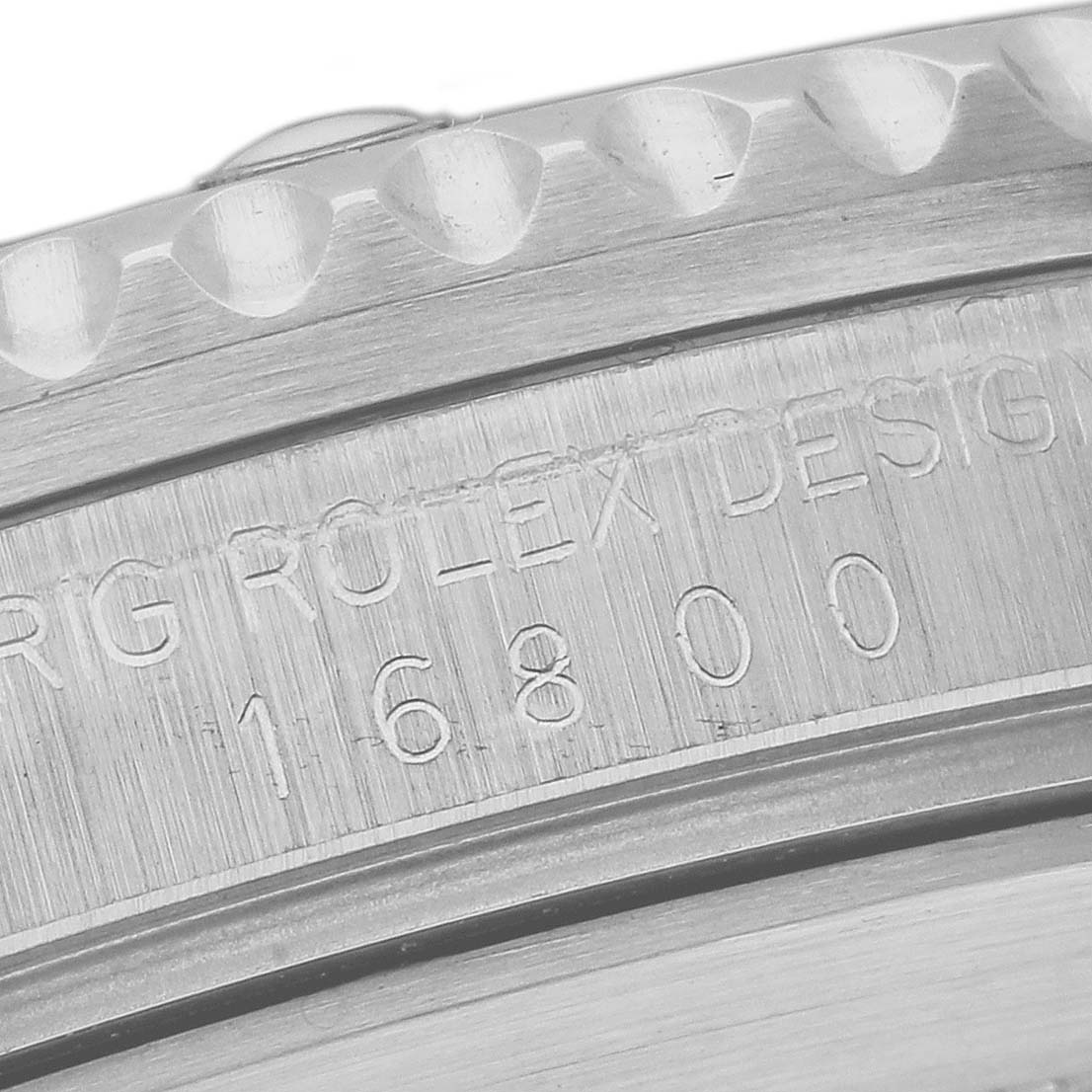 This is a close-up of the case and bezel of a Vintage Collection Rolex watch model 16800.