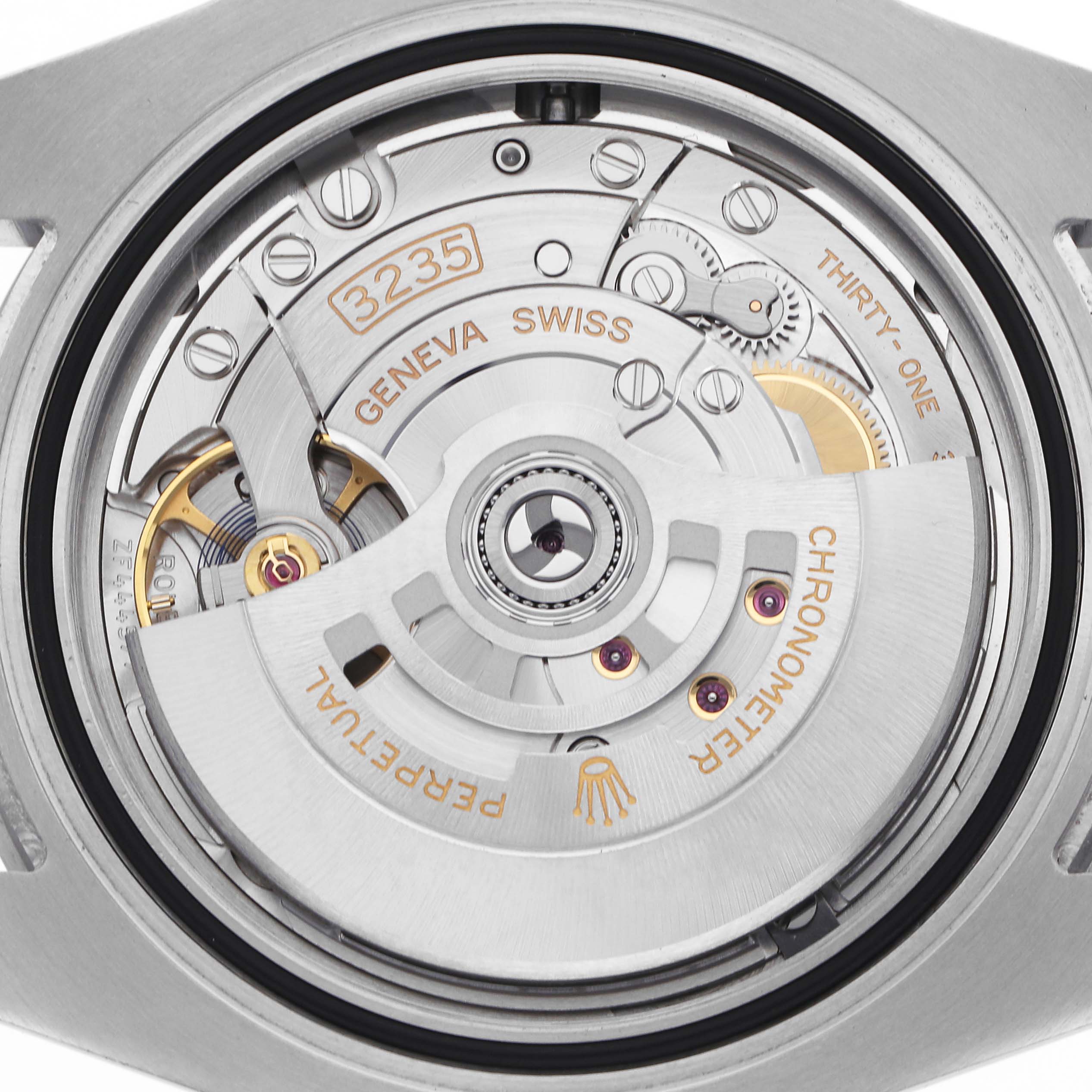 The image shows the back view of a Rolex Submariner 126610LV Men
s Stainless Steel Black Dial 126610LV Men
s Stainless Steel Black Dial
s movement, revealing gears and the rotor.