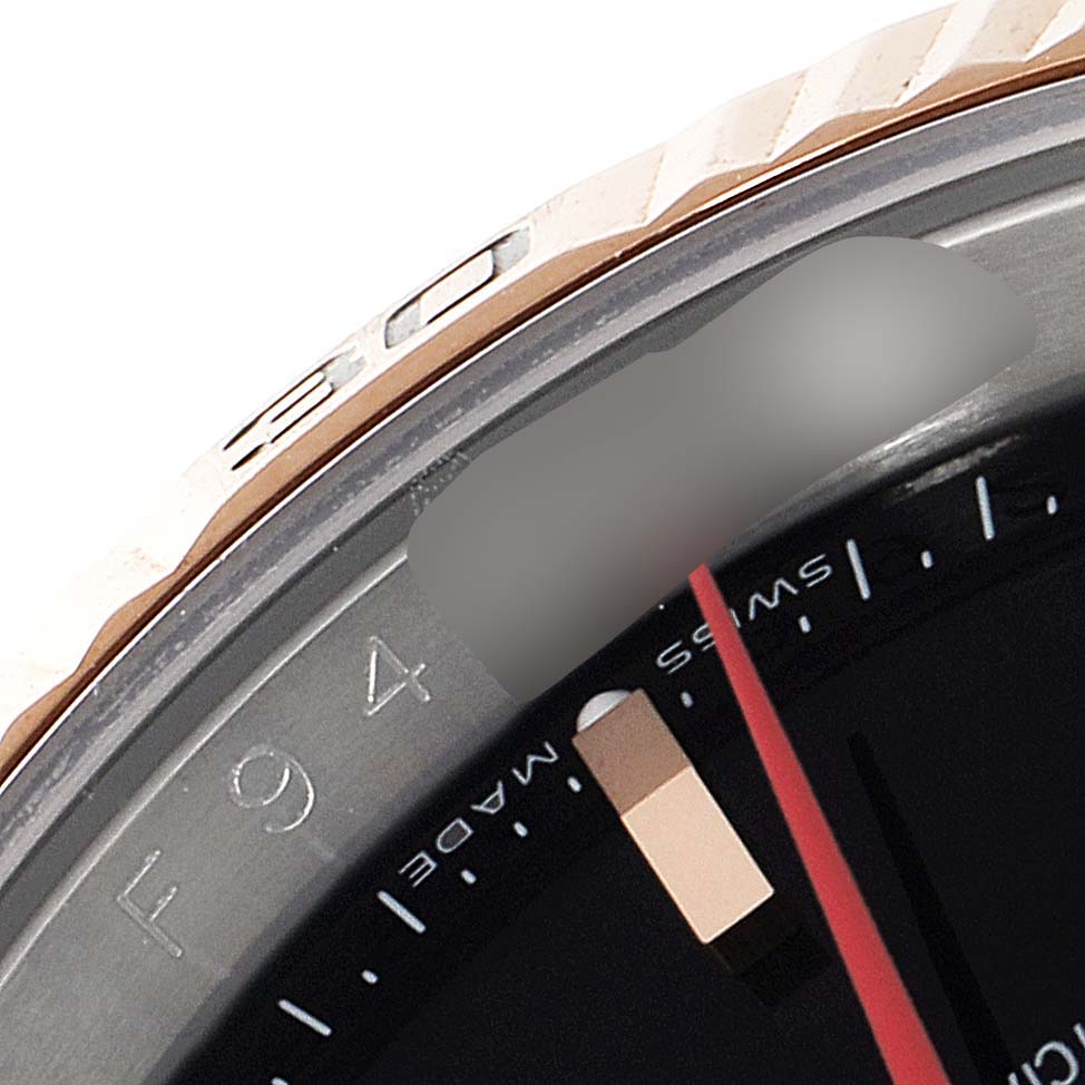 A close-up of the Rolex Turn-o-Graph 116261 Men
s Steel and Gold (two tone) Black Dial 116261 Men
s Steel and Gold (two tone) Black Dial bezel, showing the numbers, part of the dial, and the edge of the watch face.