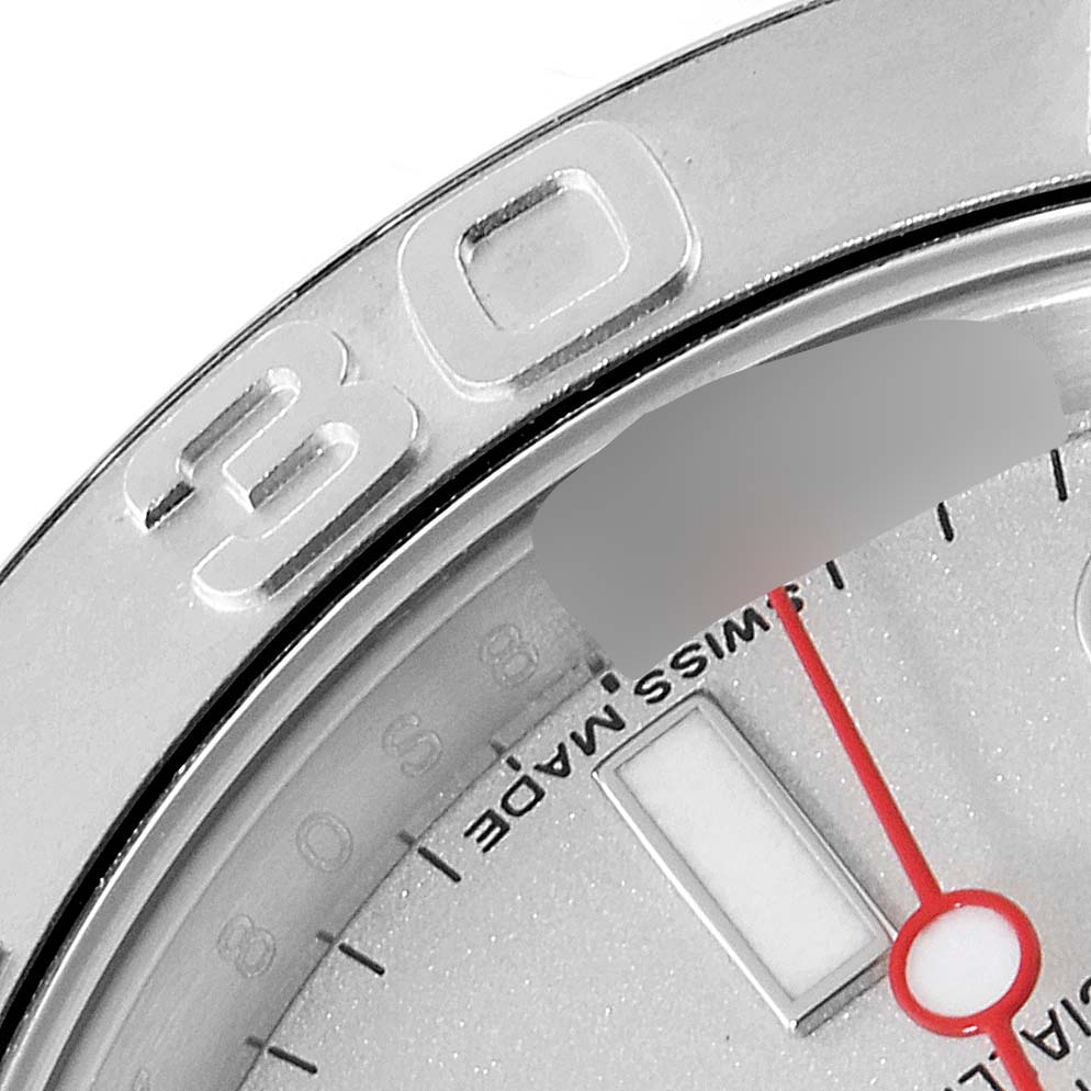 This close-up image of the Rolex Yacht-Master 116622 Men
s Stainless Steel Silver Dial 116622 Men
s Stainless Steel Silver Dial watch shows part of the bezel, dial, and the number 30.