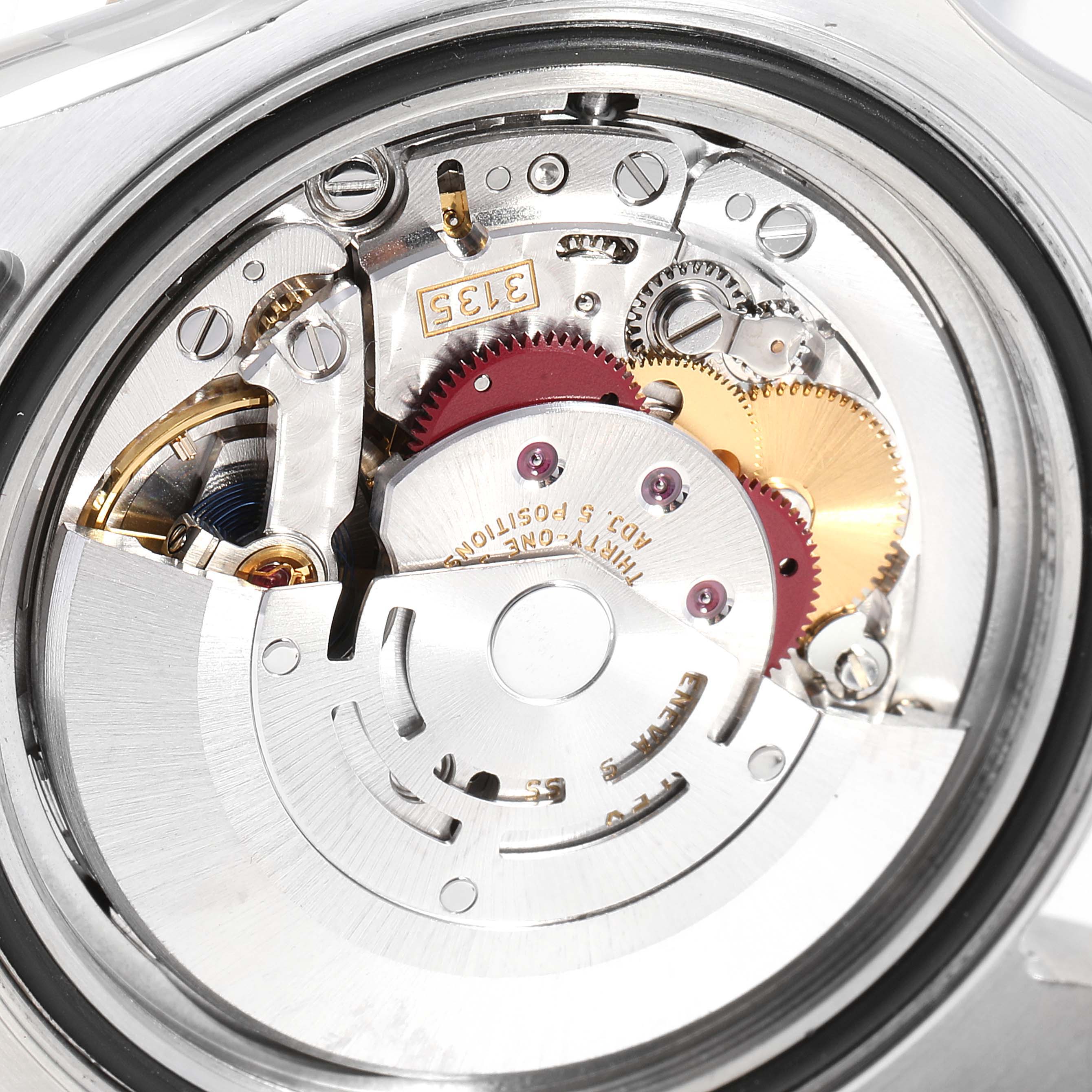 The image shows a close-up of the movement mechanism inside a Rolex Yacht-Master 16623 Men
s Steel and Gold (two tone) Blue Dial 16623 Men
s Steel and Gold (two tone) Blue Dial watch.